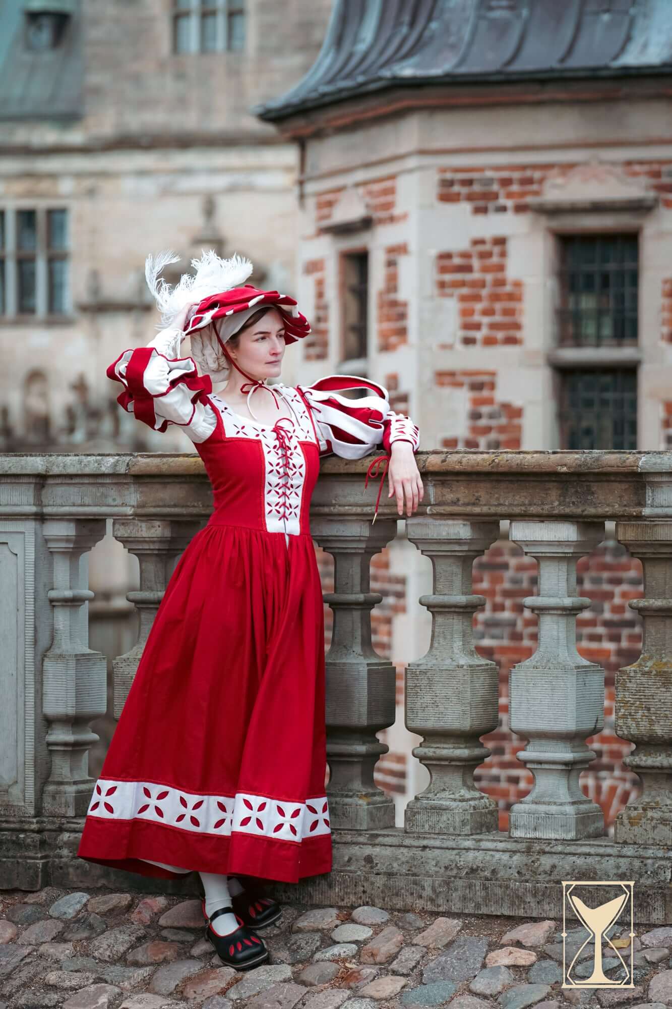 Model wearing a Kampfrau dress in bold red with historical flair, showcasing Landsknecht style details.