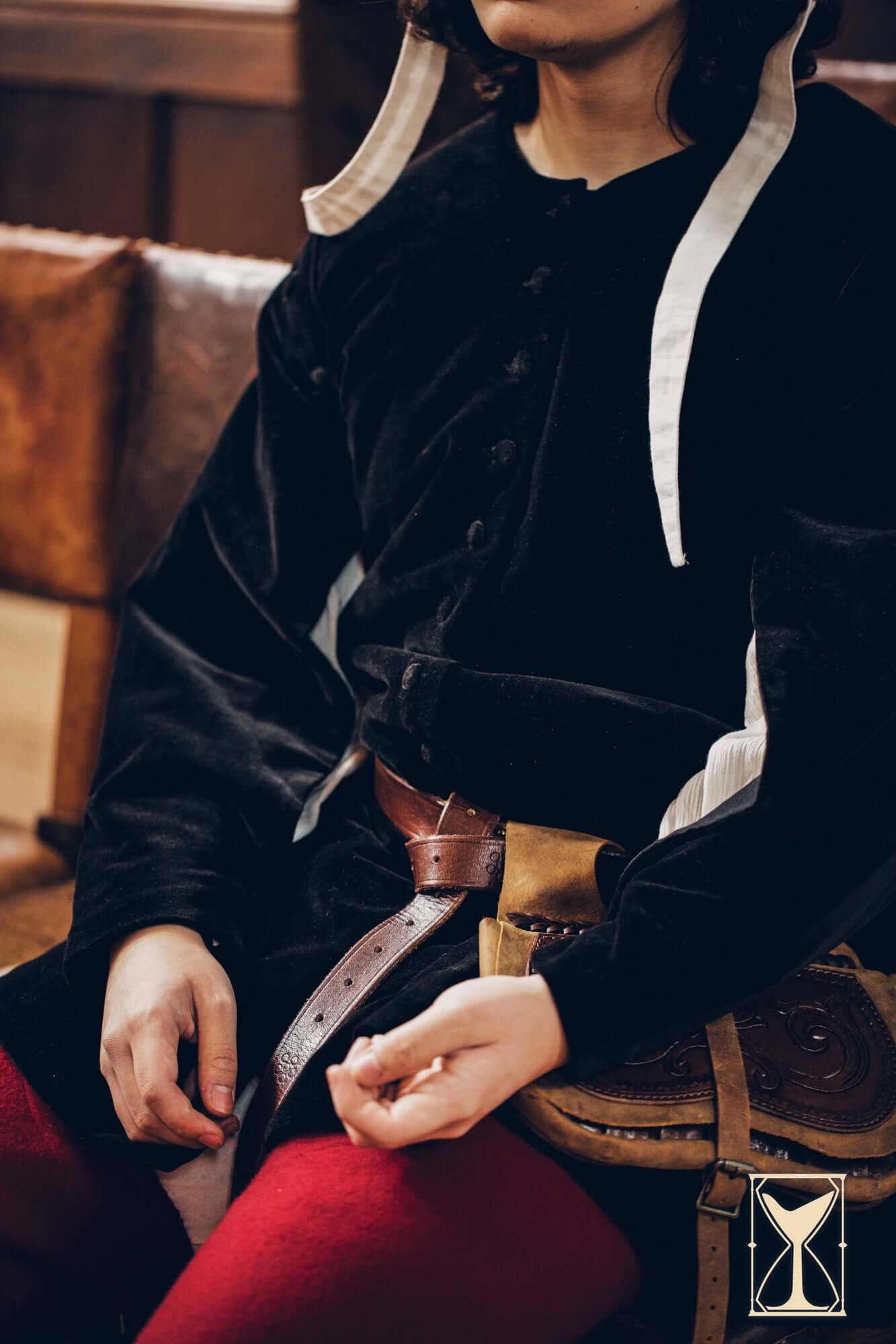 Close-up of a person wearing a Velvet Surcoat, showcasing its rich fabric and medieval style.