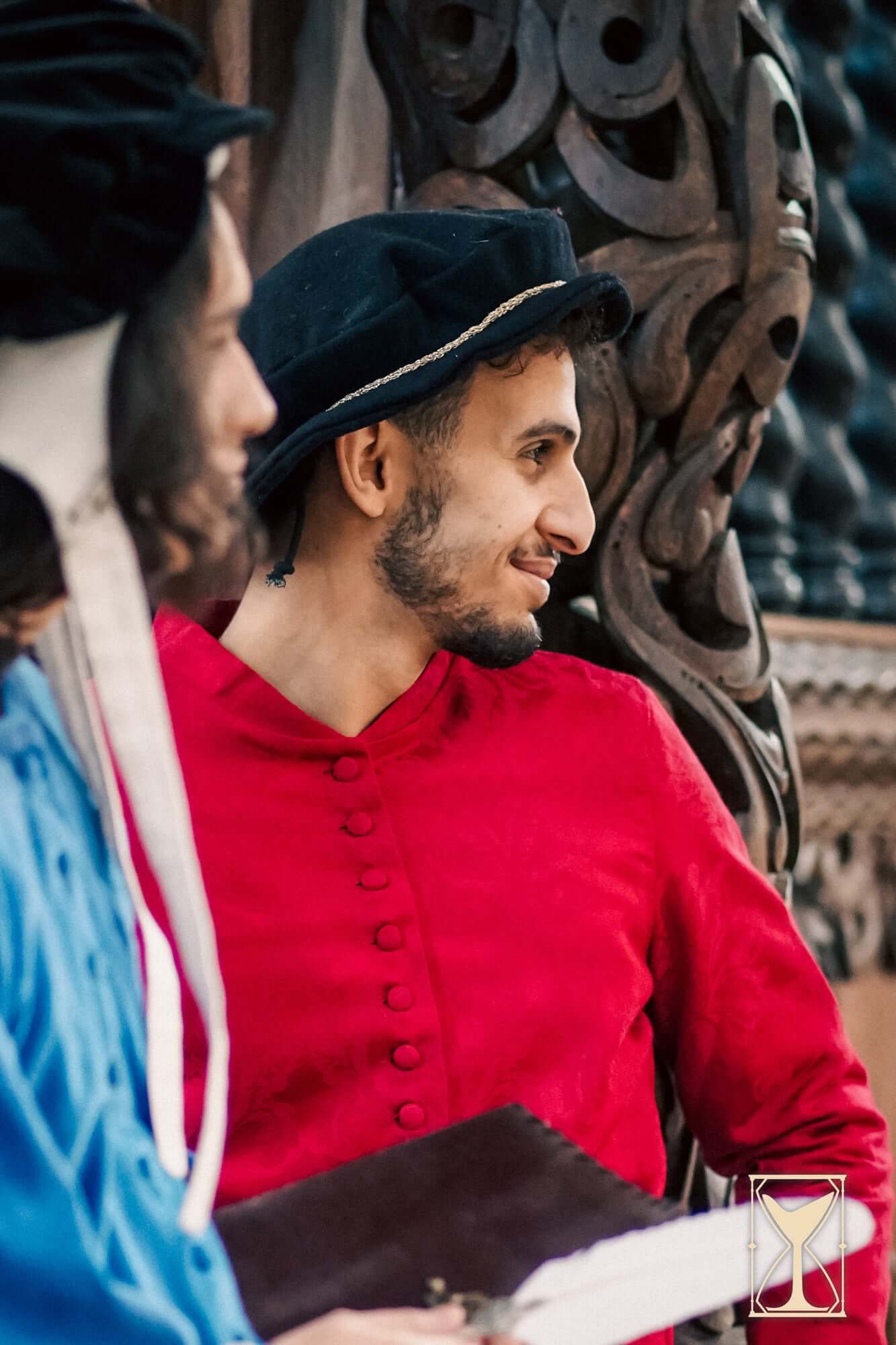 Flat Hat Edward worn by a man in a historical setting, showcasing Renaissance-era clothing and style.