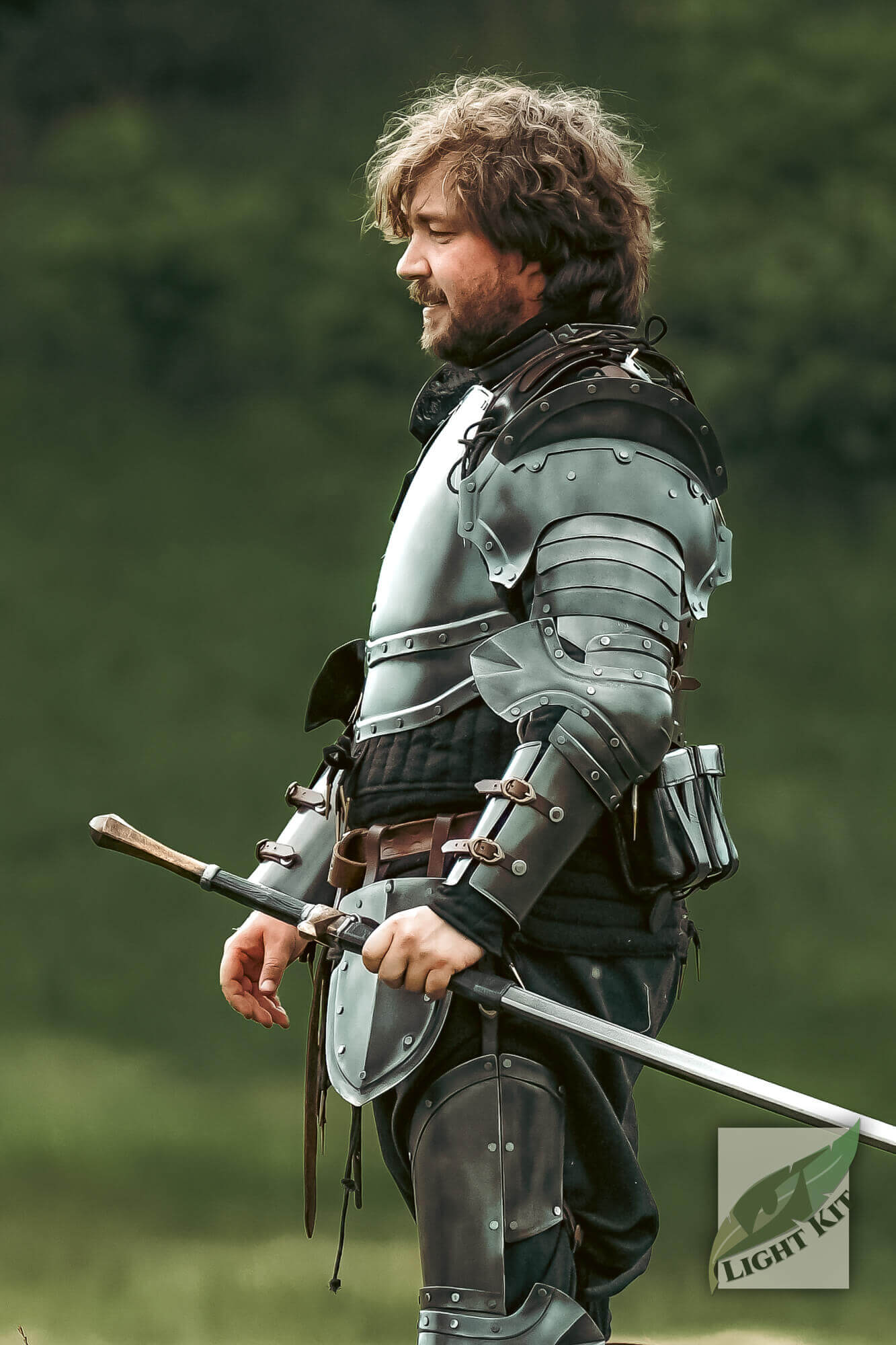 Captain Pauldrons - Light Kit worn by a fighter, showcasing its lightweight, imposing design in a battle-ready stance.