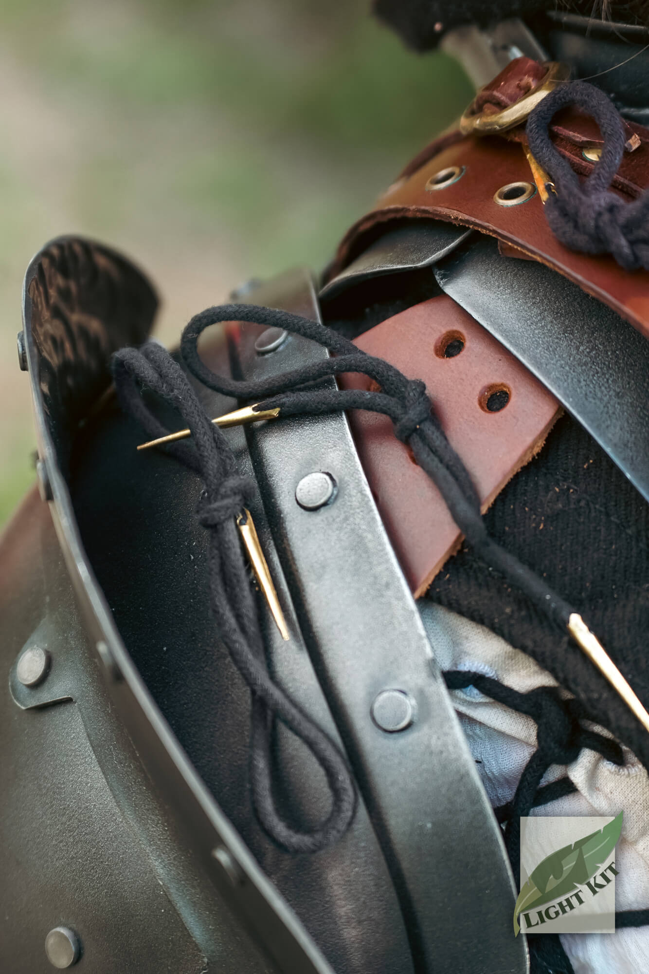 Close up of shoulder armor tie fitting