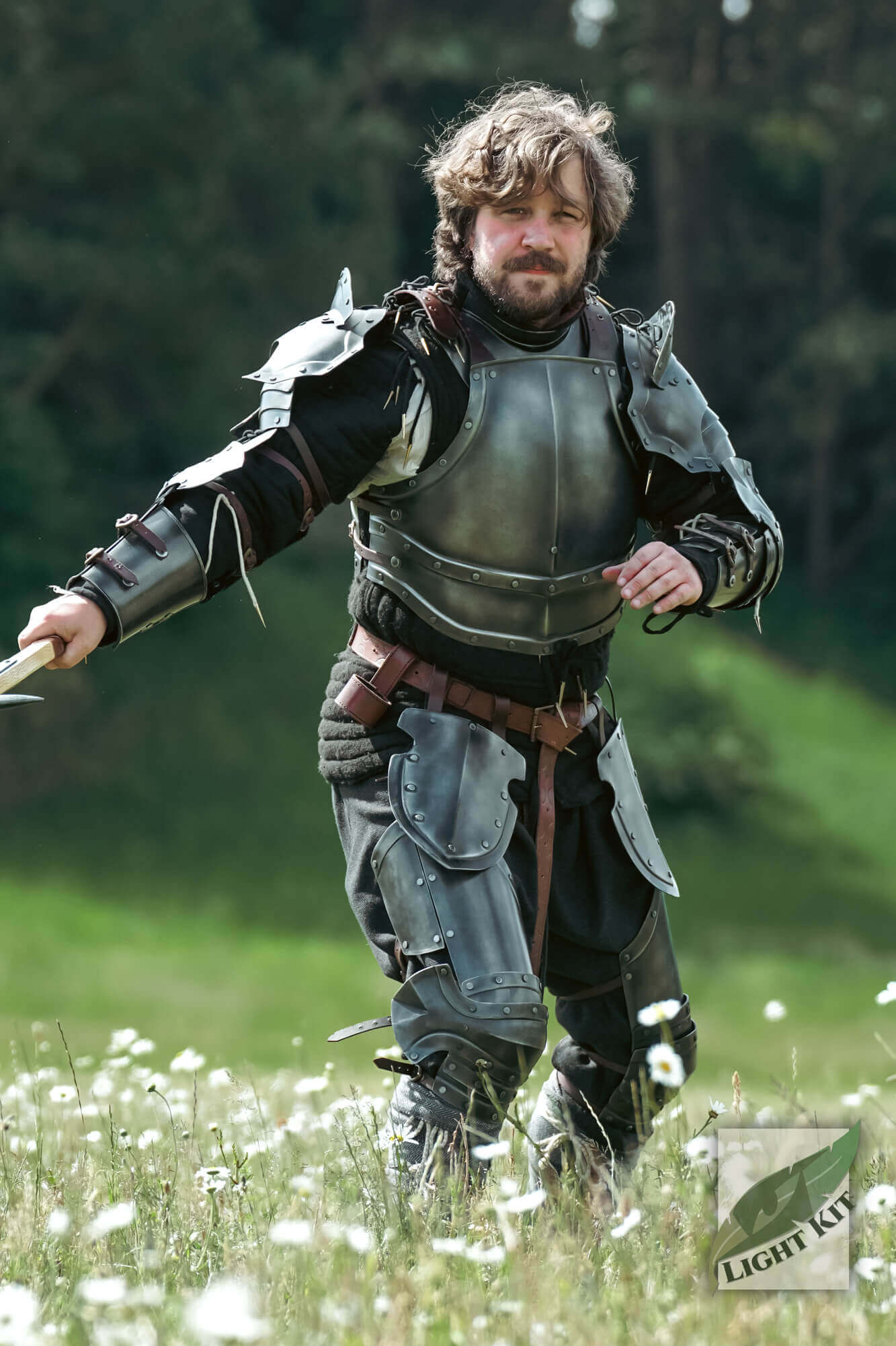 Man in armor demonstrating Captain Leg Protection - Light Kit in a field.