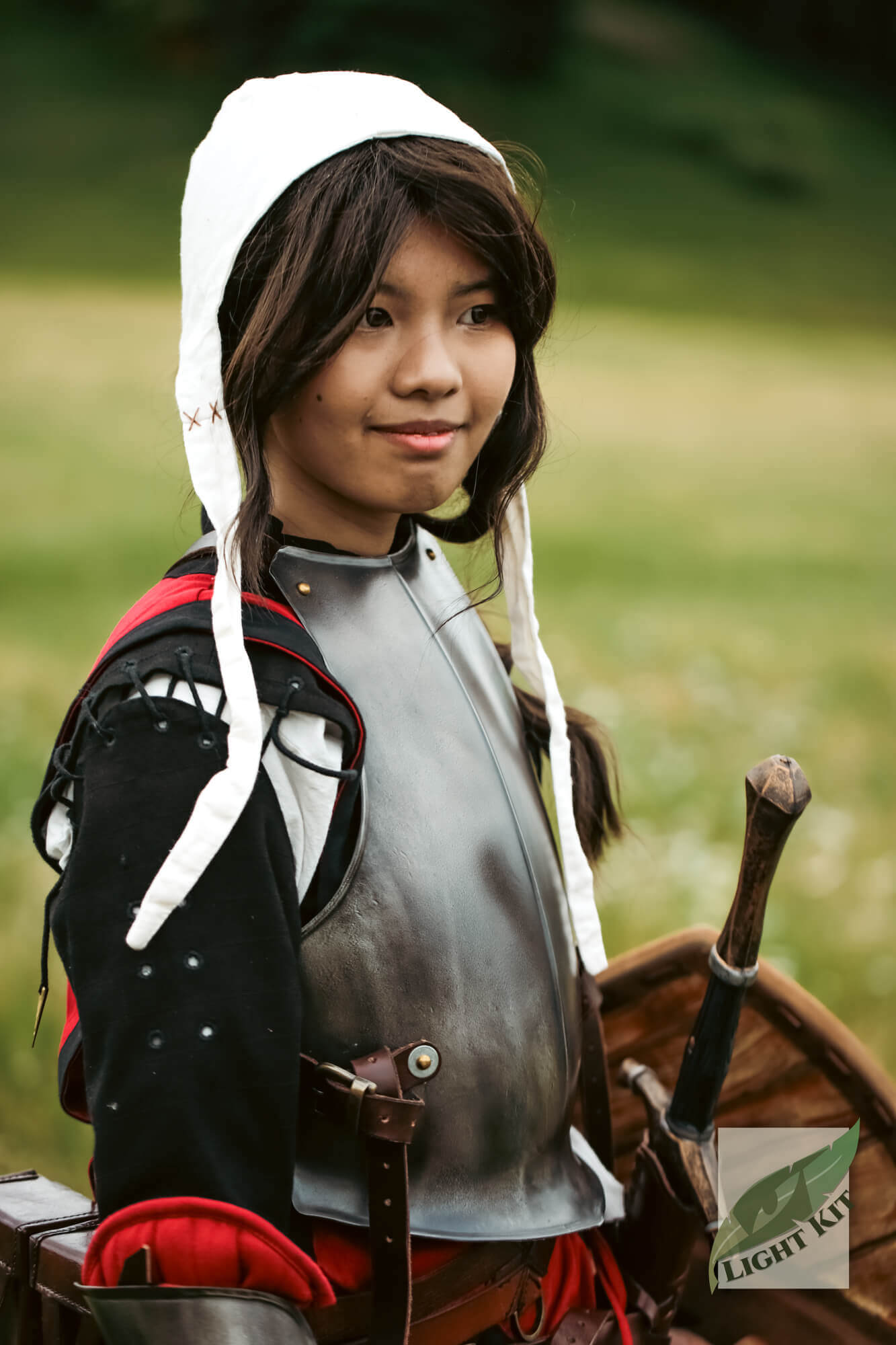 RFB Breastplate - Light Kit worn by a smiling person in armor, showcasing mobilility and comfort in outdoor setting.