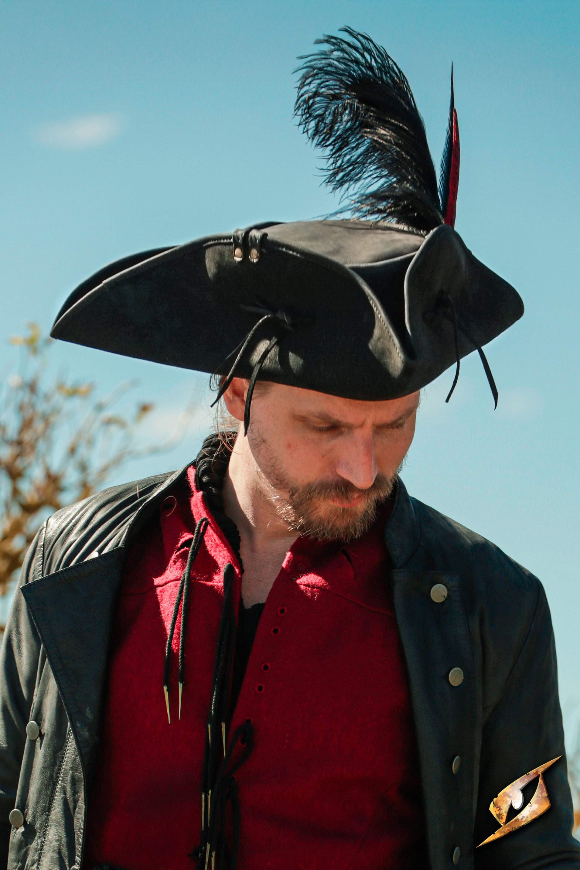 Simple Leather Pirate Tricorn Hat worn by a man in a black coat, outdoors with a plume.