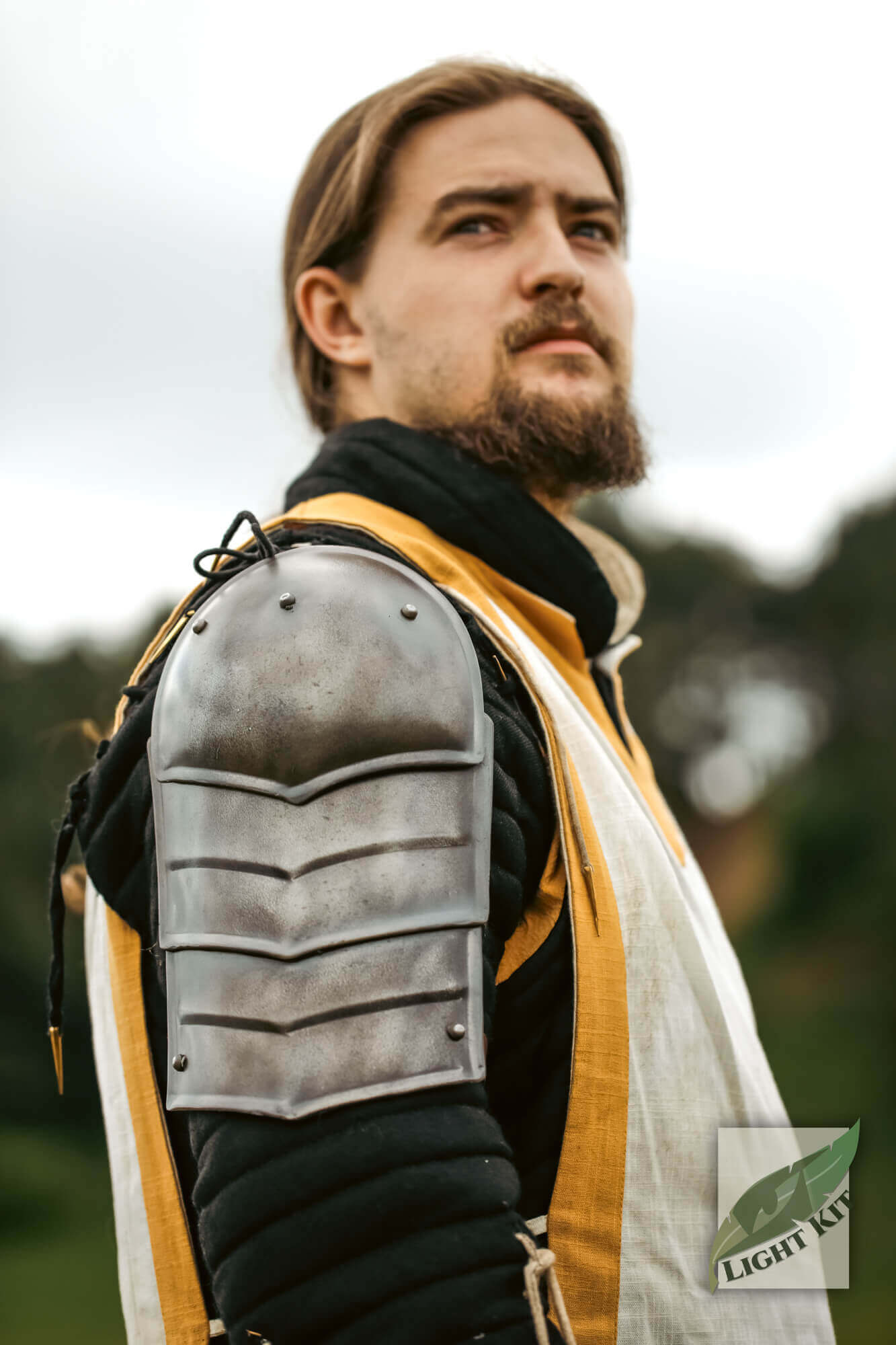Shoulder Plate Merc - Light Kit worn by a man in armor with PU shoulder guard and spaulder details.