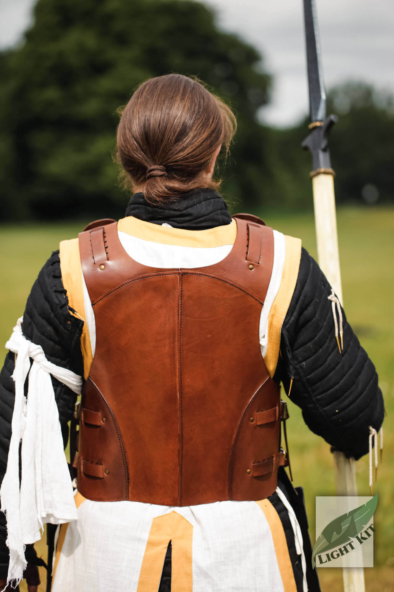 Torso Armour Merc - Light Kit shown from the back on a person in a field, highlighting its hybrid cuirass design.