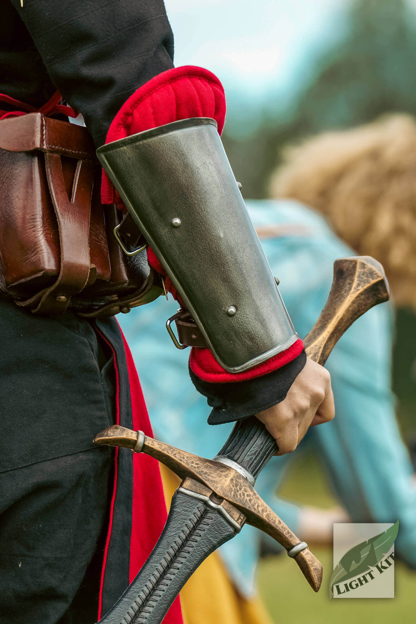 RFB Arm Protection - Light Kit worn by a character holding a sword, showcasing versatile forearm armor.