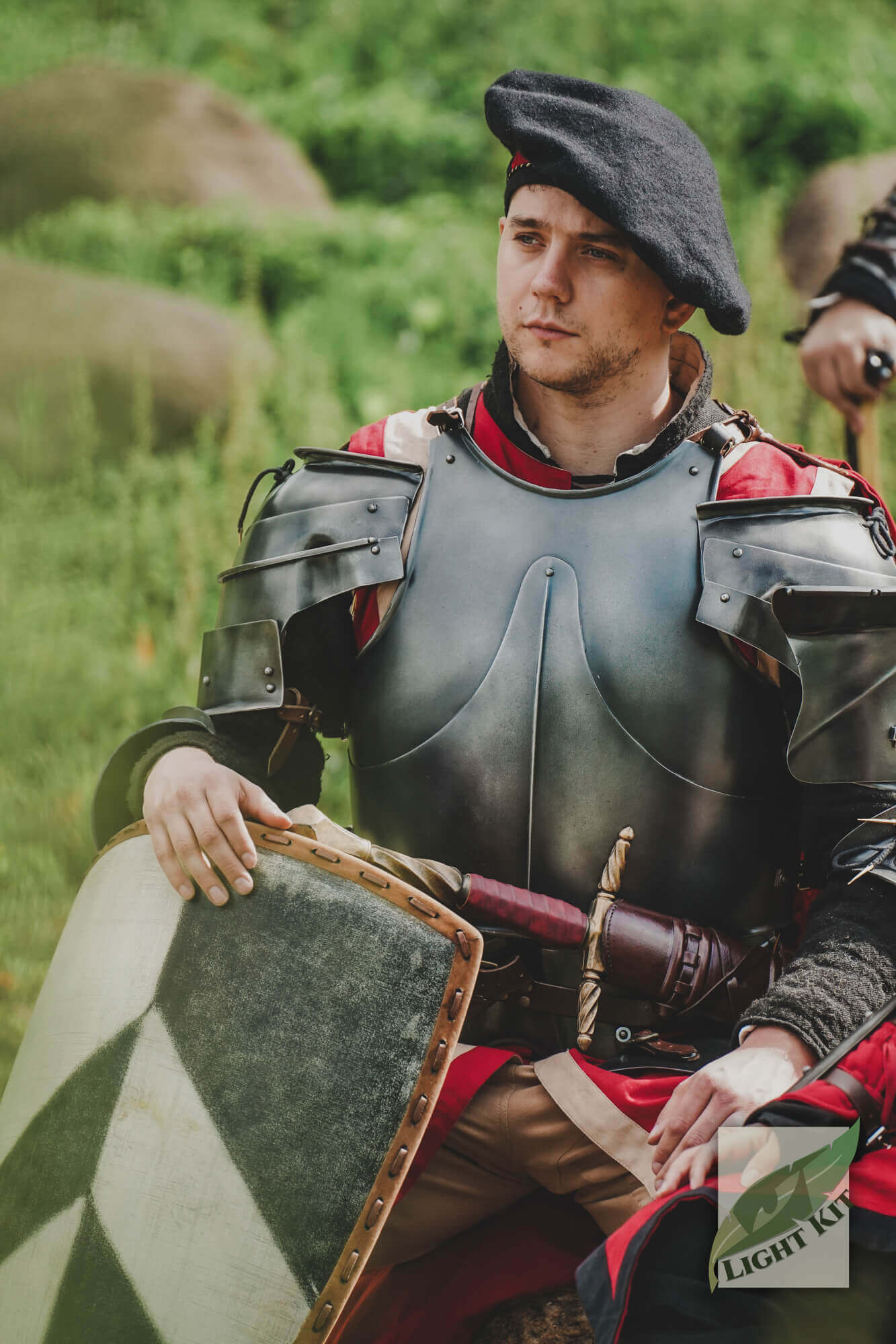 Milanese Armour - Light Kit worn by a man in historical attire, showcasing agility and style in a green setting.