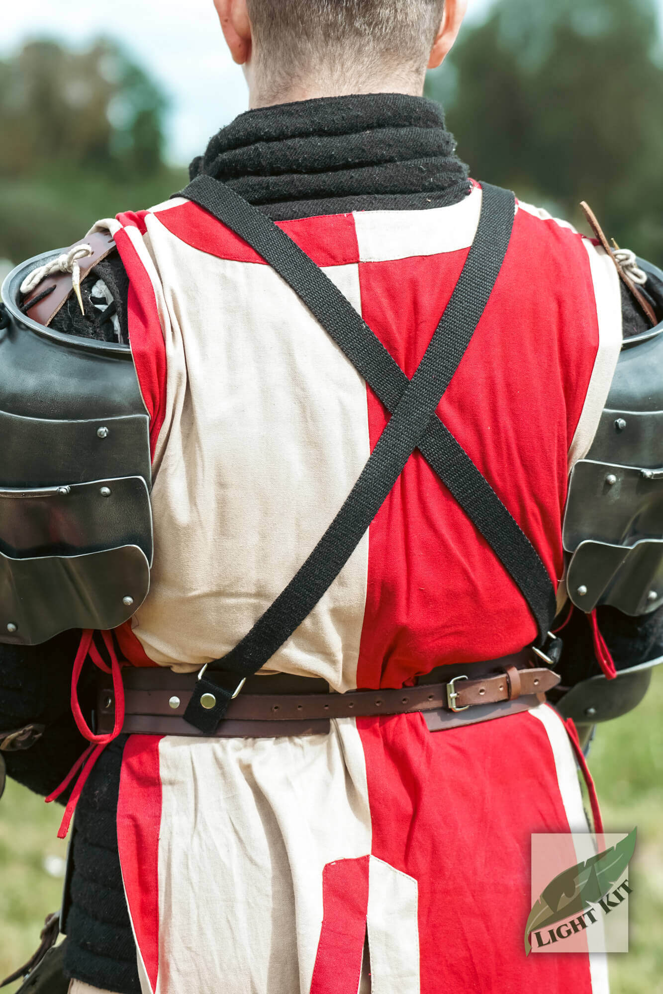 Back view of armored individual wearing Faulds and Tassets - Light Kit, demonstrating mobility and protection.