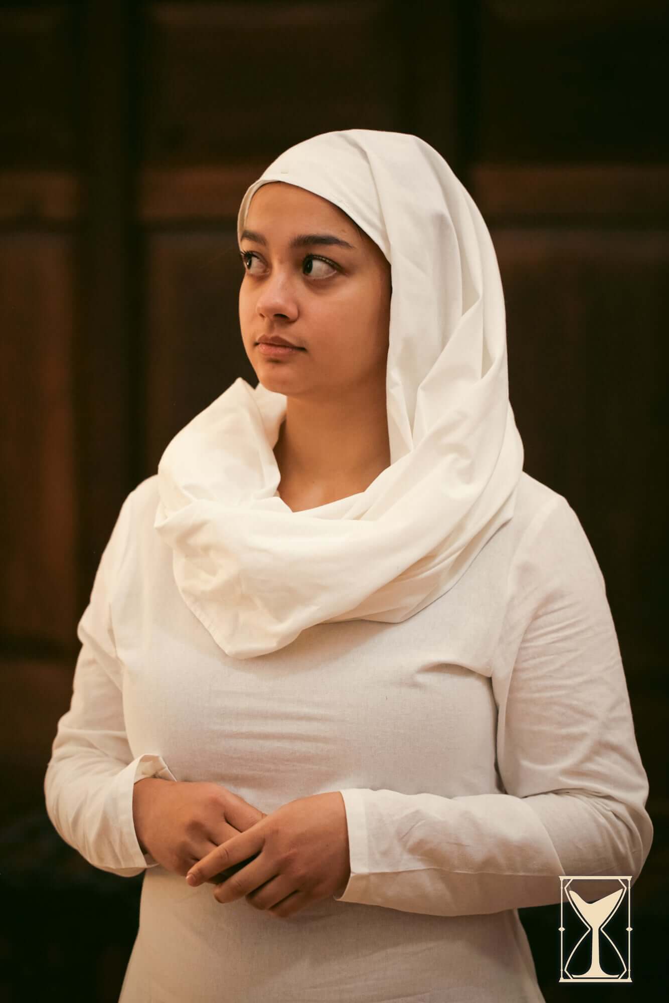 Rectangular Veil and Fillet - Cotton worn by a woman, adding historical authenticity to costumes.