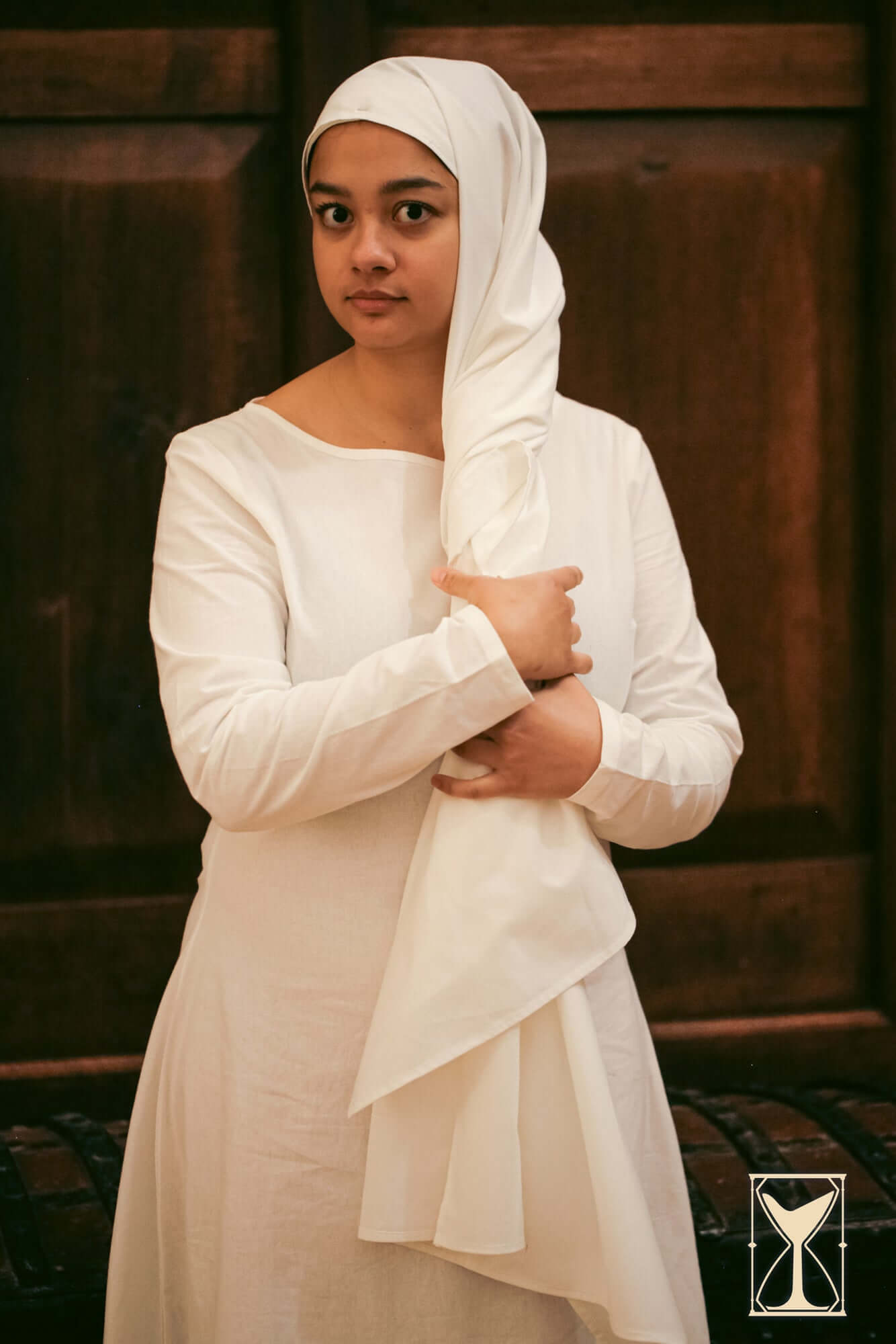 Rectangular Veil and Fillet - Cotton worn by a woman in a white dress, showcasing historical style and modesty.