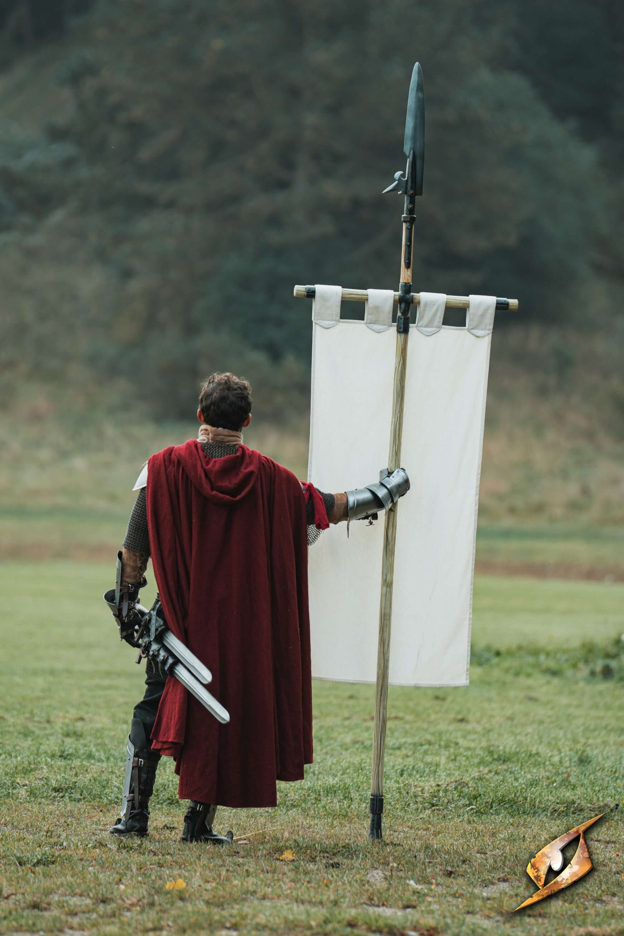 Complete Battle Standard Set - Fauchard Top displayed by a figure in a red cloak holding a pole with a banner.