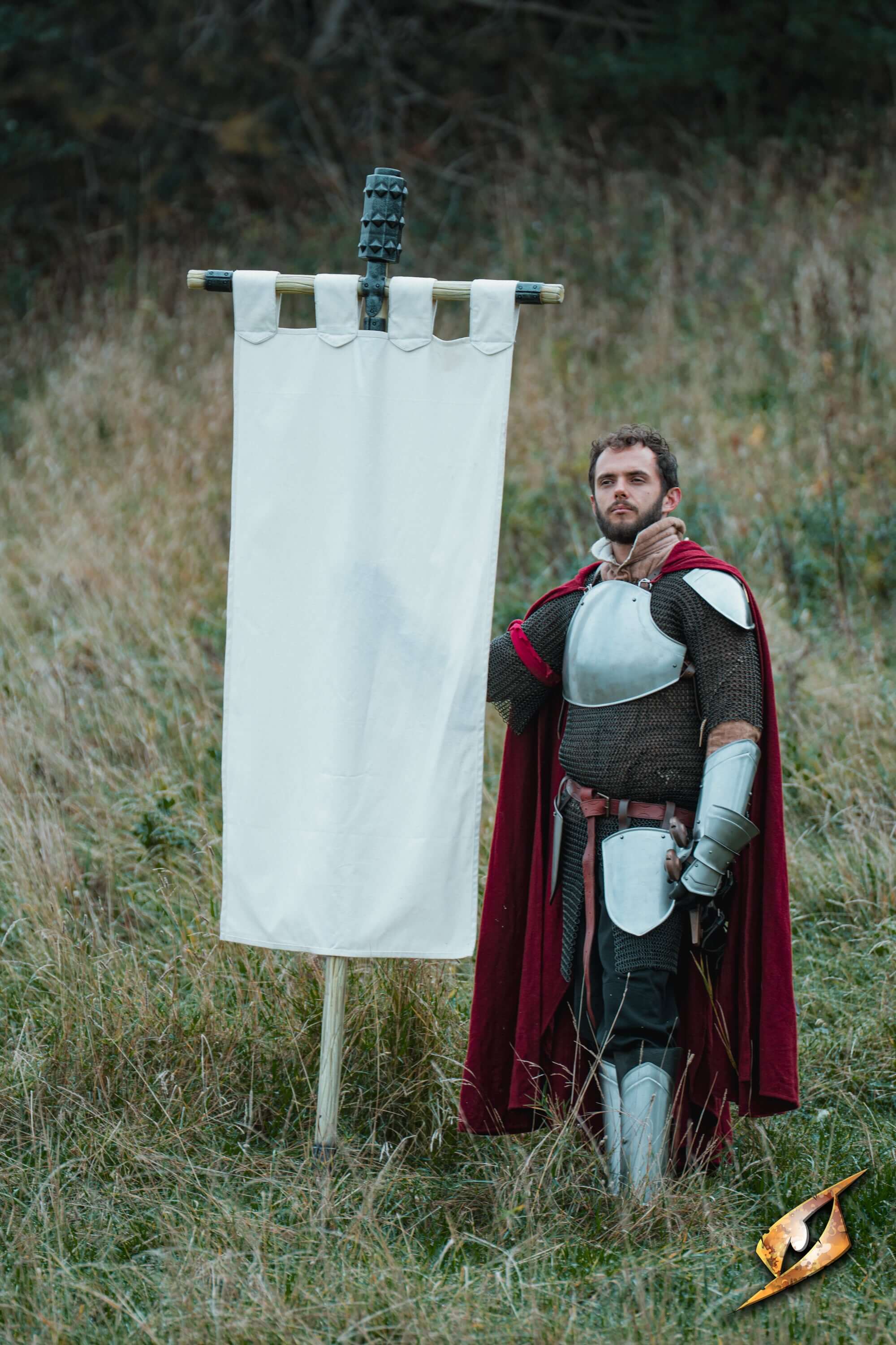 Complete Battle Standard Set - Spiked Mace Top displayed by a knight next to a blank banner on a grassy field.