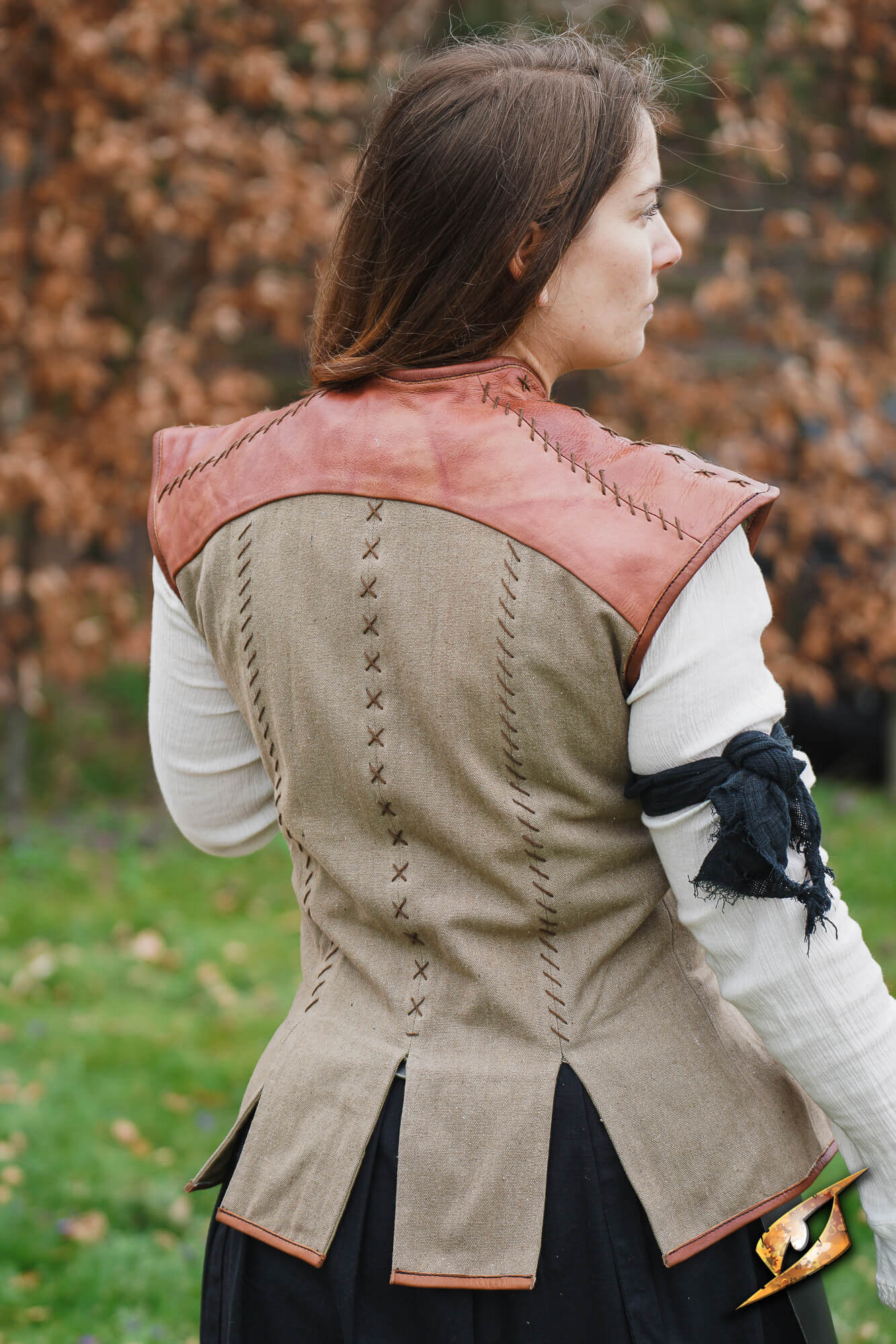Rugged Canvas Jerkin showcasing a sleeveless design with leather shoulder reinforcement and decorative stitching.