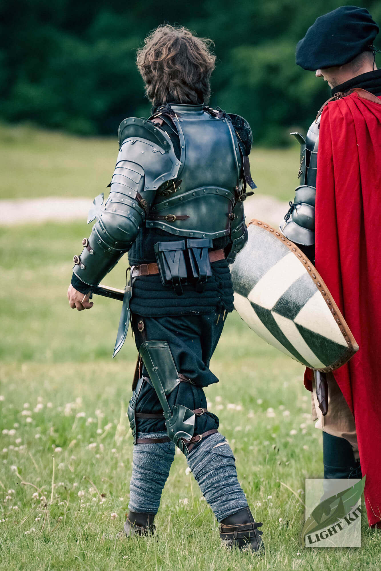 Captain Complete Set - Light Kit showcased by a player wearing a full armour set, ready for battle in a field.