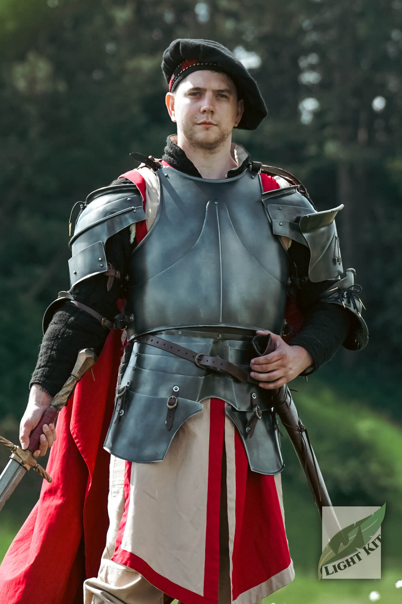 Milanese Complete Set - Light Kit worn by a knight with sword in an outdoor setting.