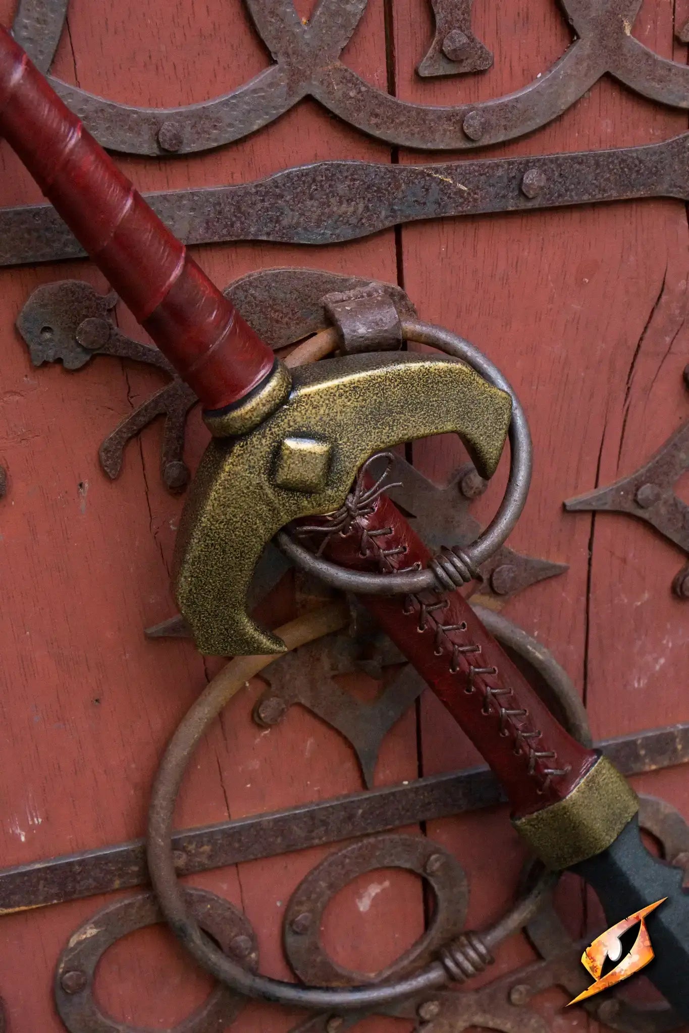 Baal - 140 cm sword detail against a rustic wooden door background, showcasing craftsmanship and design elements.