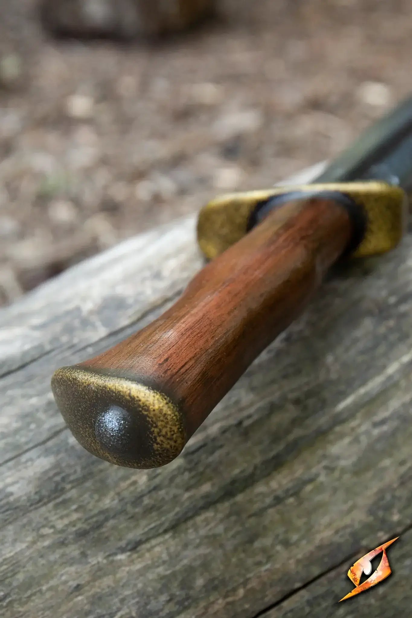 Close-up of the handle of the Bowie - 46 cm knife with a wooden grip and gold cross-guard, showcasing its pragmatic design.