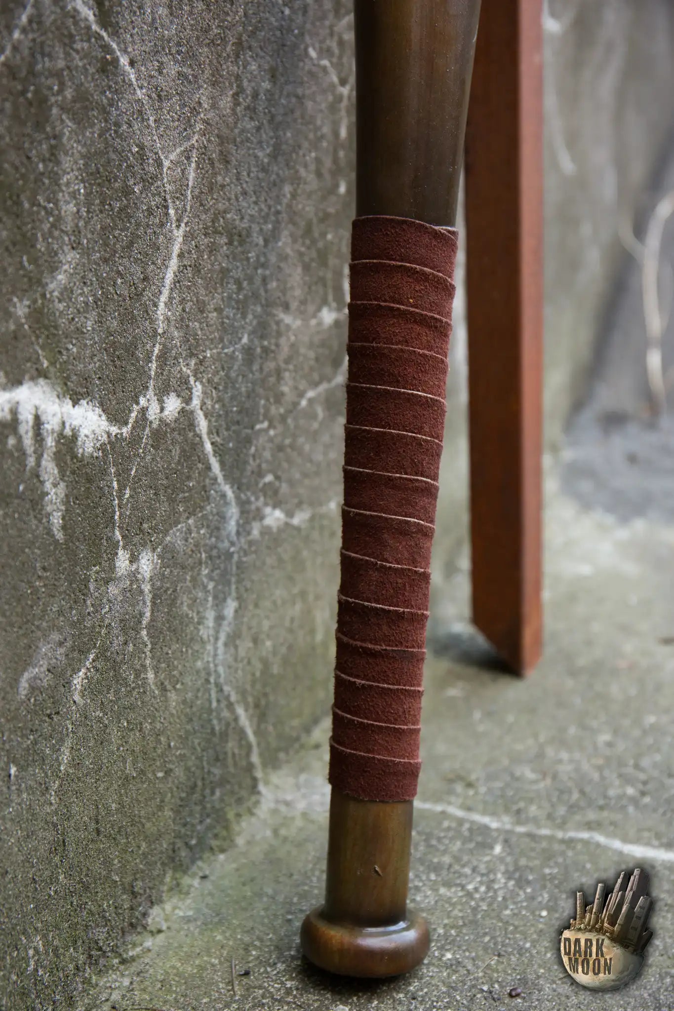 Close-up of the Barbed Wire Bat grip, showcasing the brown wrap on a foam baseball bat designed for post-apocalyptic themes.