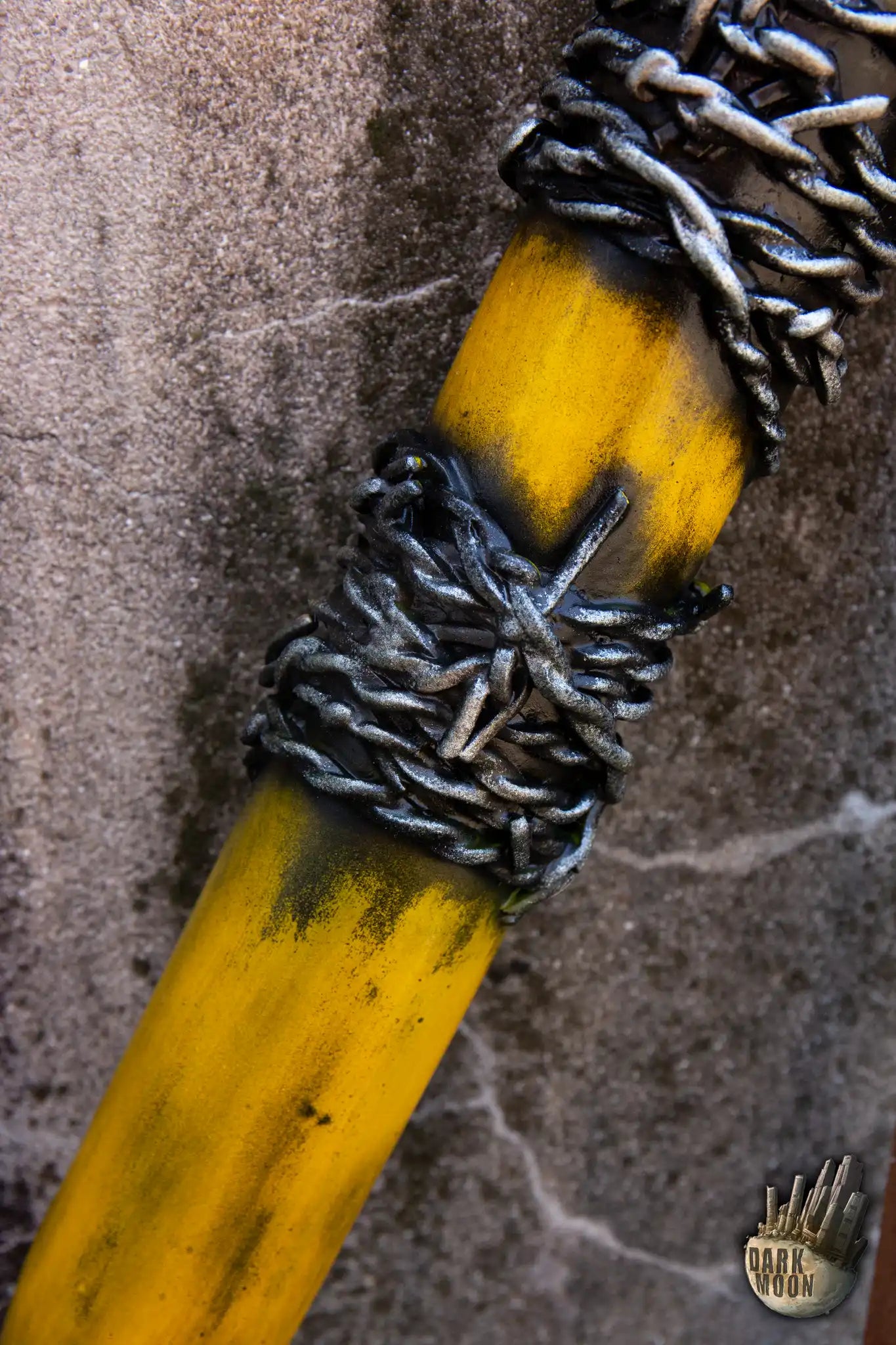 Barbed Wire Bat with yellow body and metallic barbed wire wrapping for a post-apocalyptic look