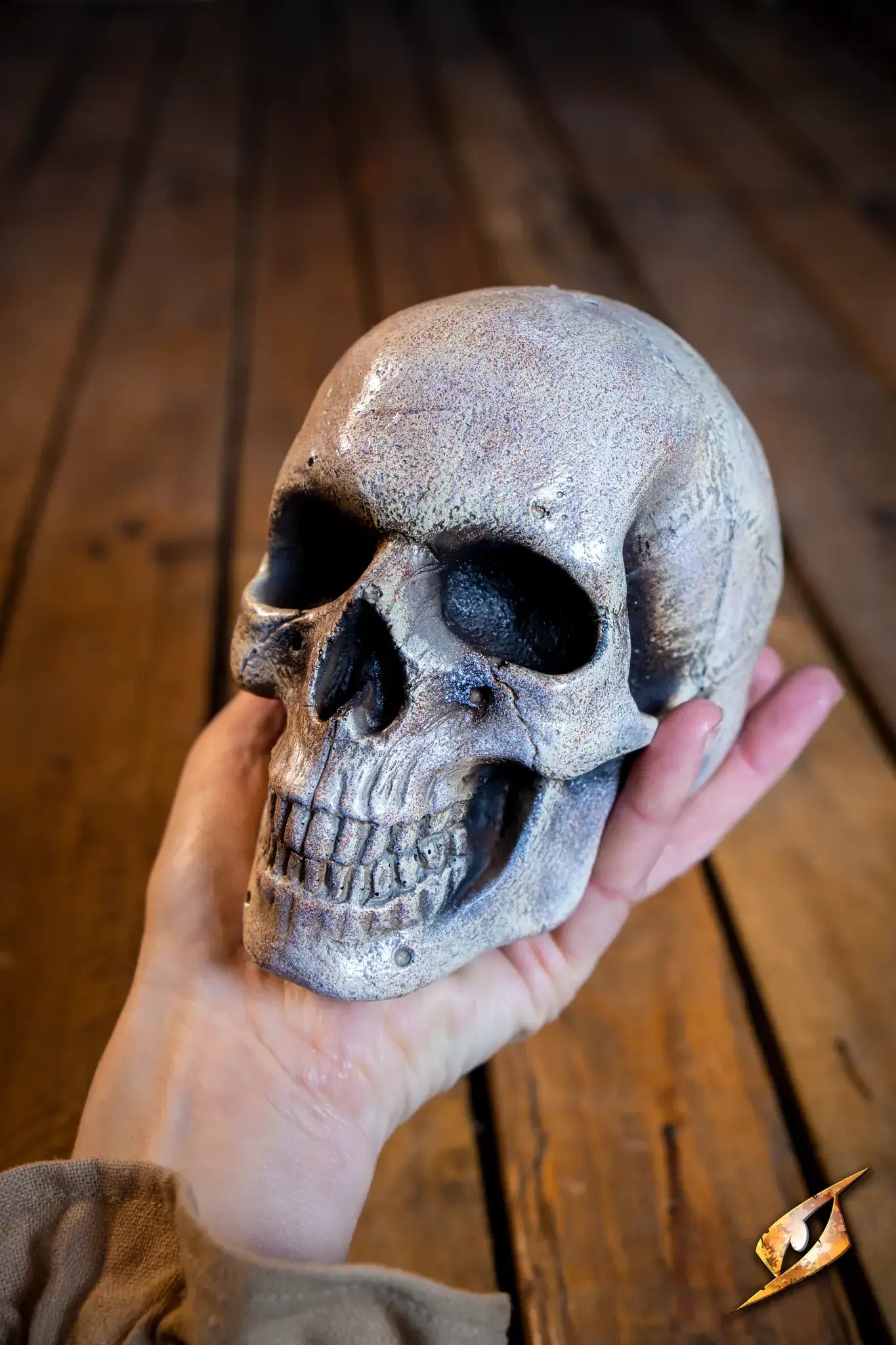 Medium Skull held in hand, perfect for necromancers and magical spellcasting.