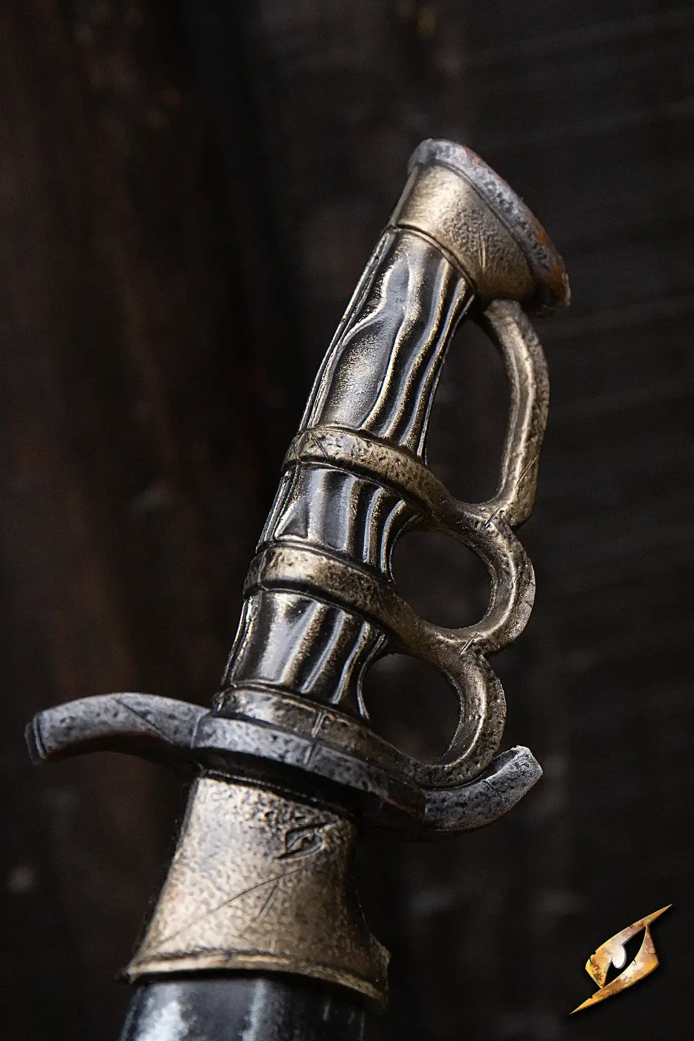 Close-up of the intricate knuckleduster handle of the Battleworn Trench Knife, showcasing detailed wear and craftsmanship.