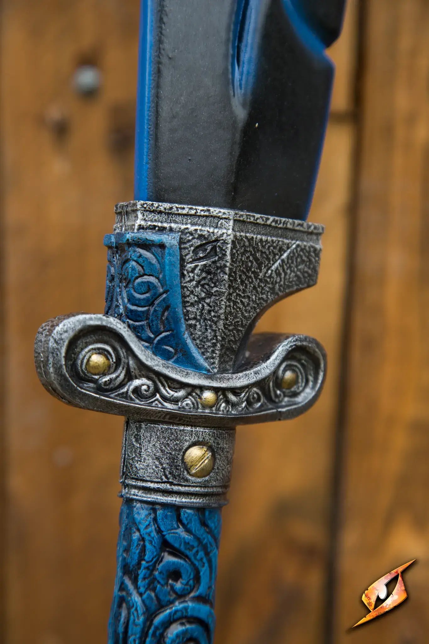 Close-up of the ornate hilt of the Magic Dao sword, showcasing intricate designs and craftsmanship.