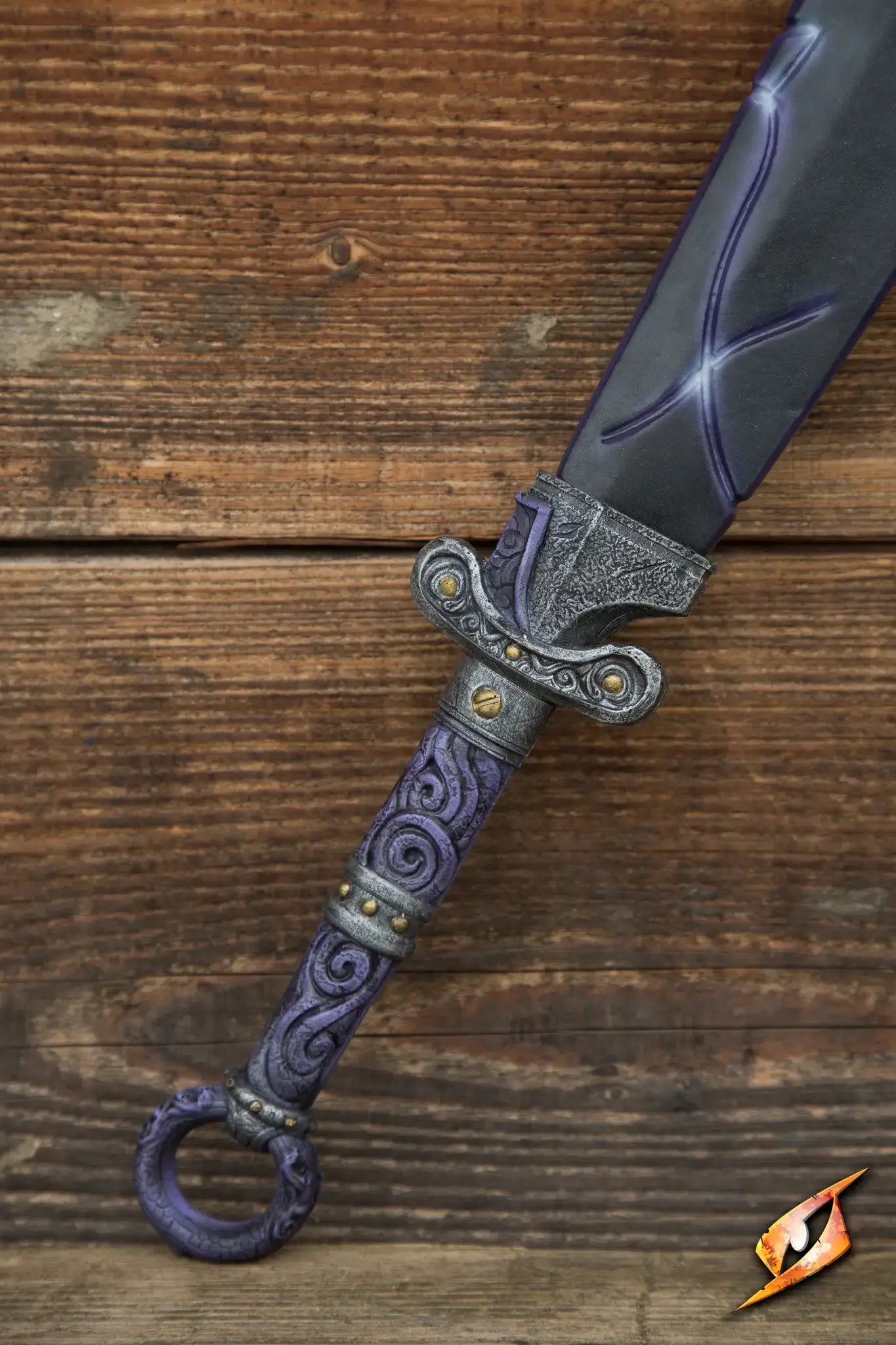 Magic Dao sword featuring intricate designs on the handle and glowing blade, resting on a wooden surface.