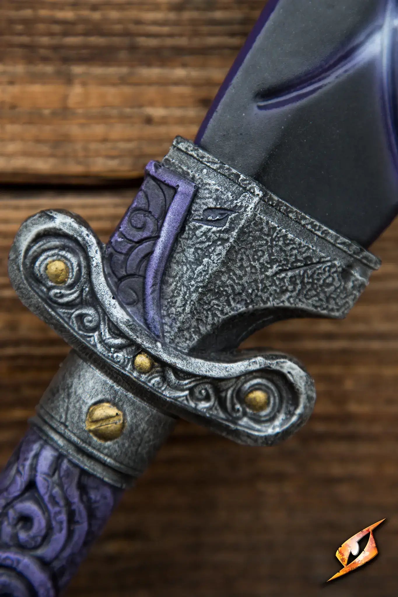 Close-up of the ornate hilt and blade of the Magic Dao, featuring intricate designs and a sleek purple finish.