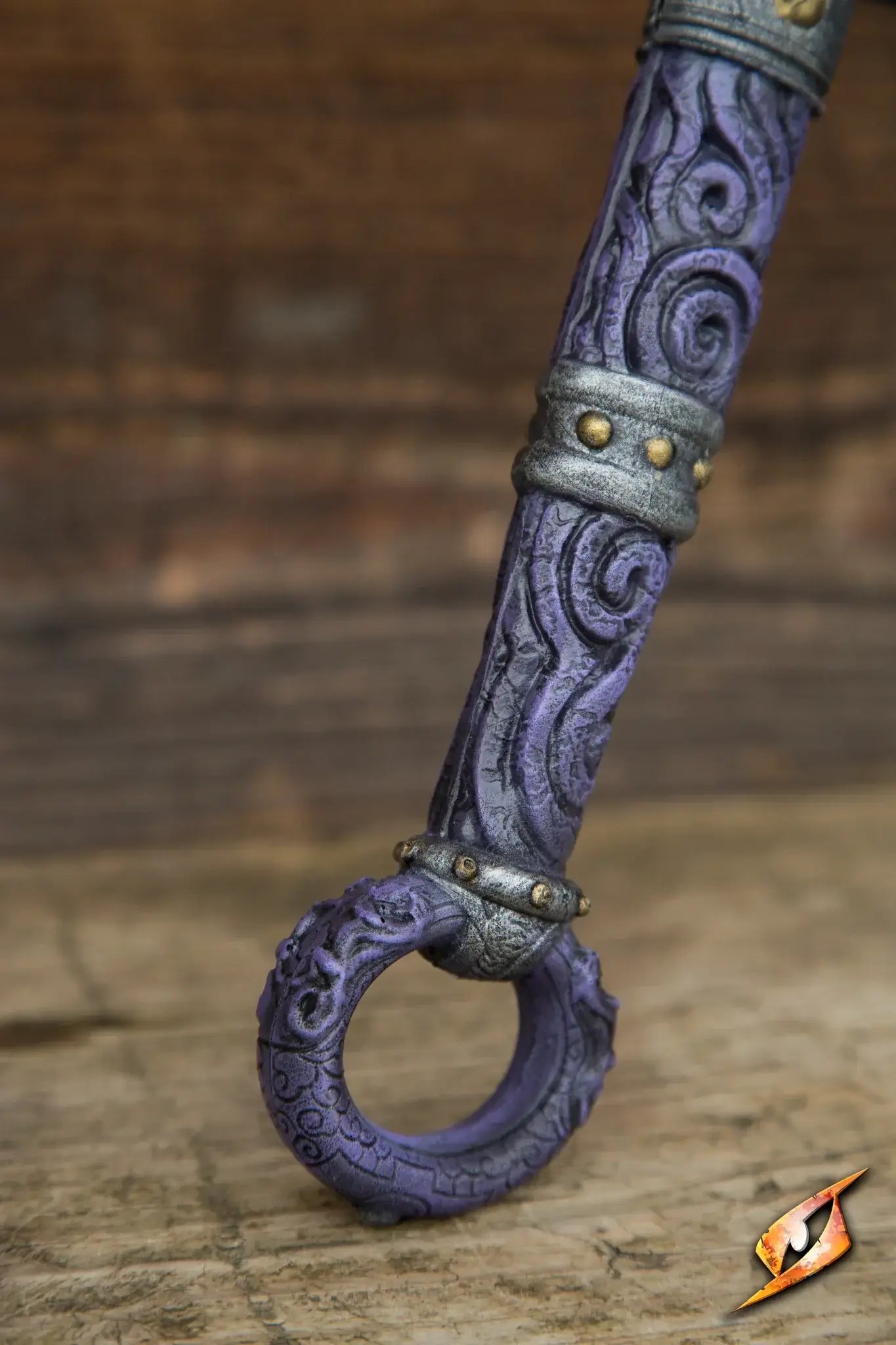 Close-up of a detailed purple Magic Dao with intricate designs and metallic accents.