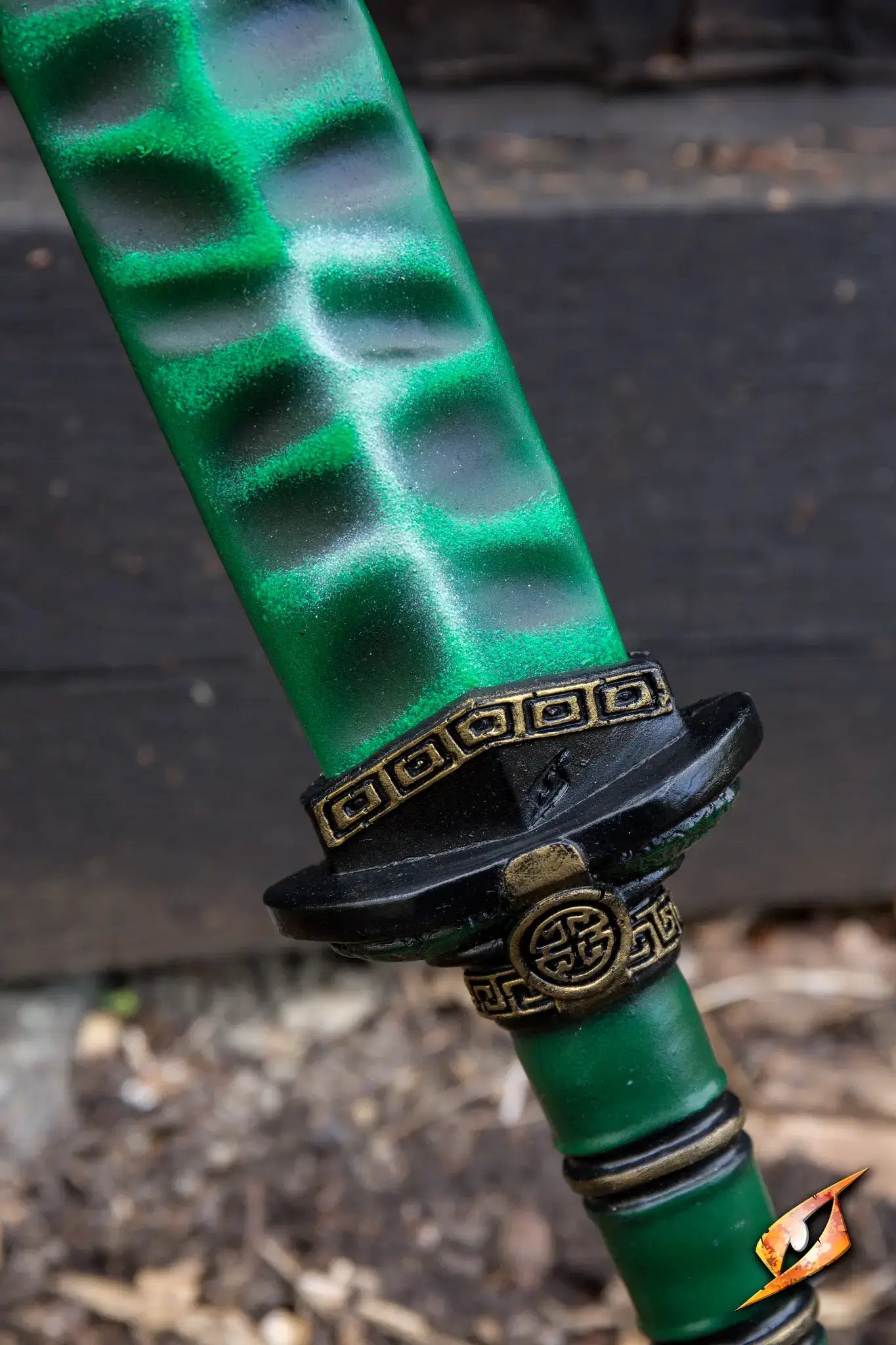 Close-up of the Magic Jian with a green blade and ornate hilt design, showcasing its detailed craftsmanship.