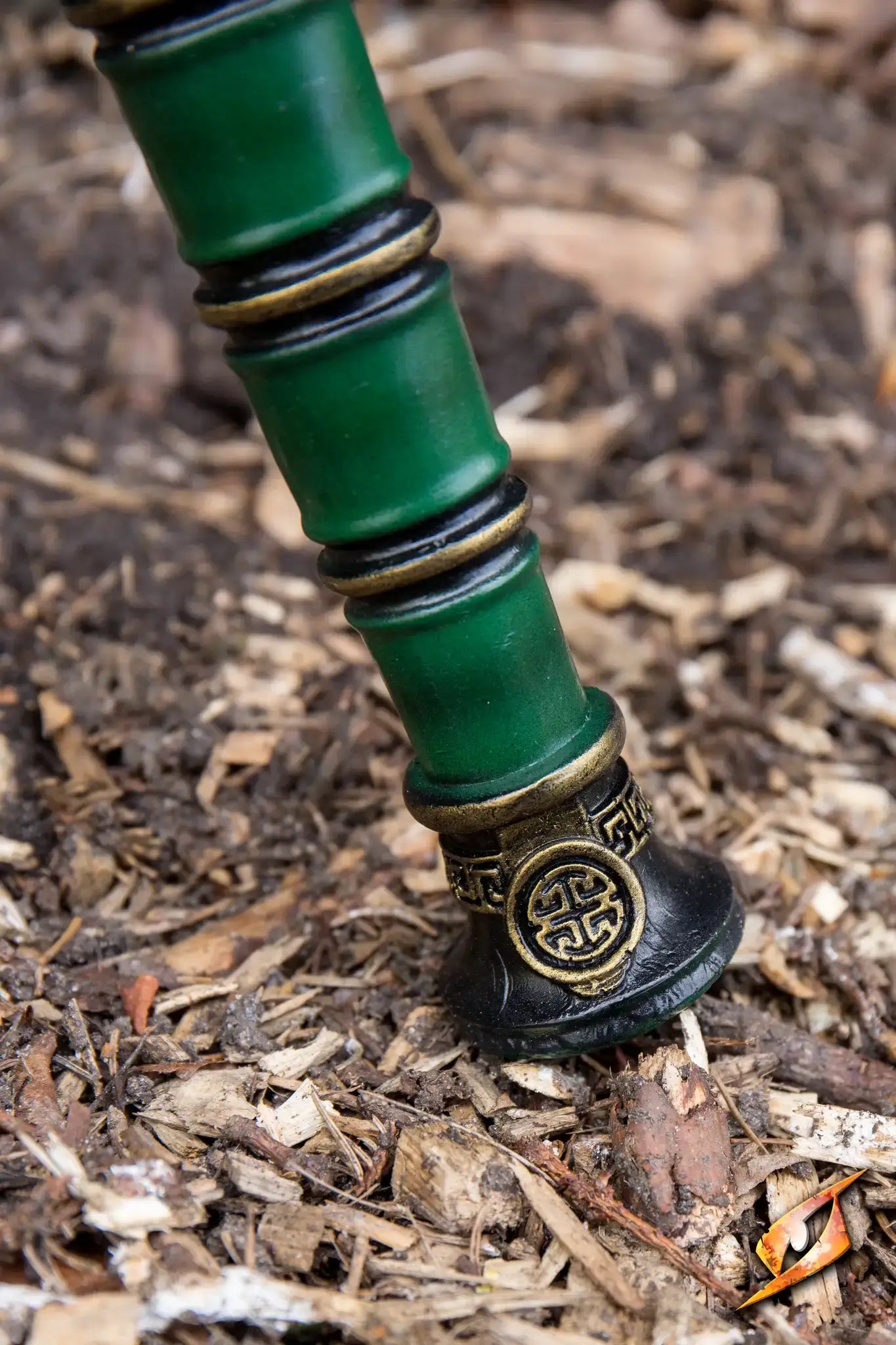 Close-up of the Magic Jian weapon embedded in the ground, showcasing its intricate design and powerful presence.
