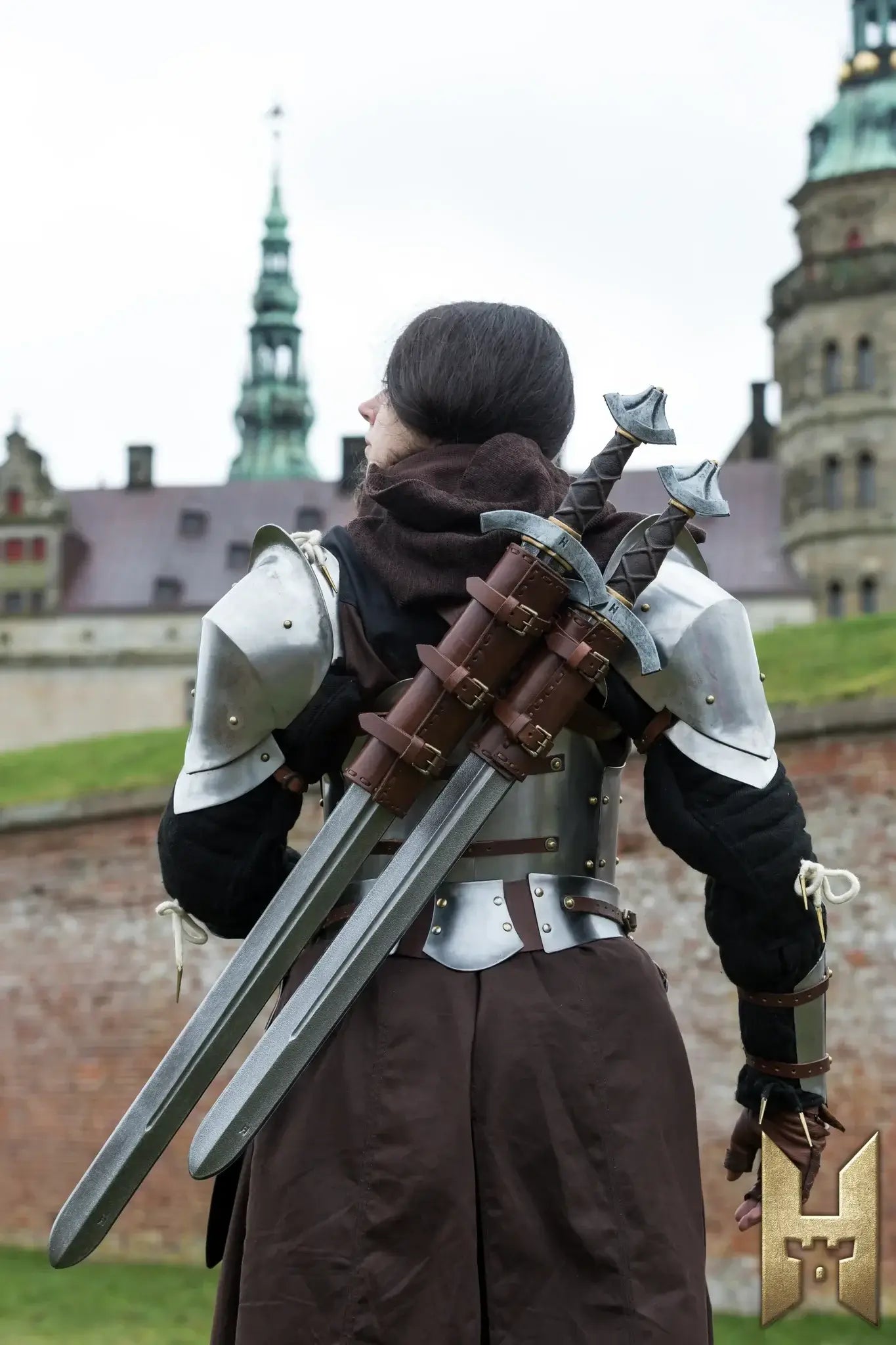Arming Sword displayed behind a character in medieval armor, ready for LARP battles and cosplay adventures.