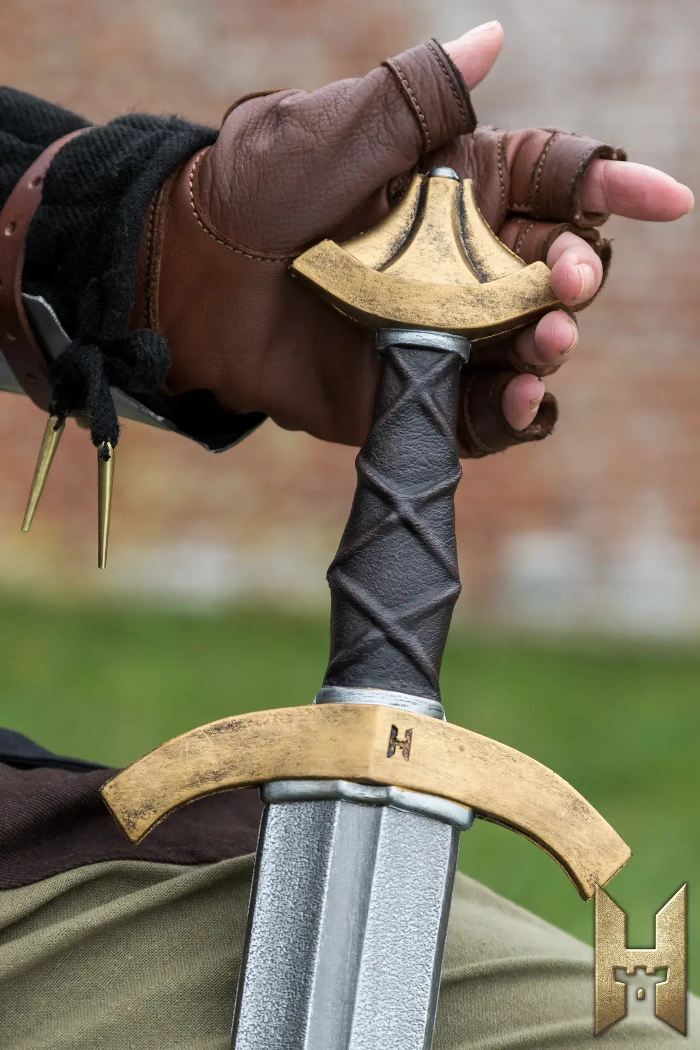 Detailed hand grip on an Arming Sword, showcasing craftsmanship and medieval design for LARP and cosplay.