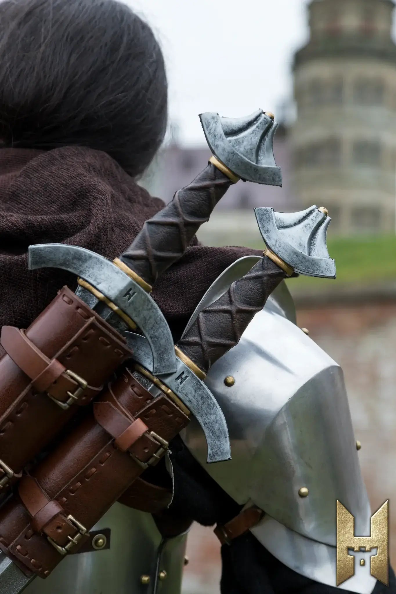 Person wearing armor with two Arming Swords strapped on their back, ready for a LARP adventure.