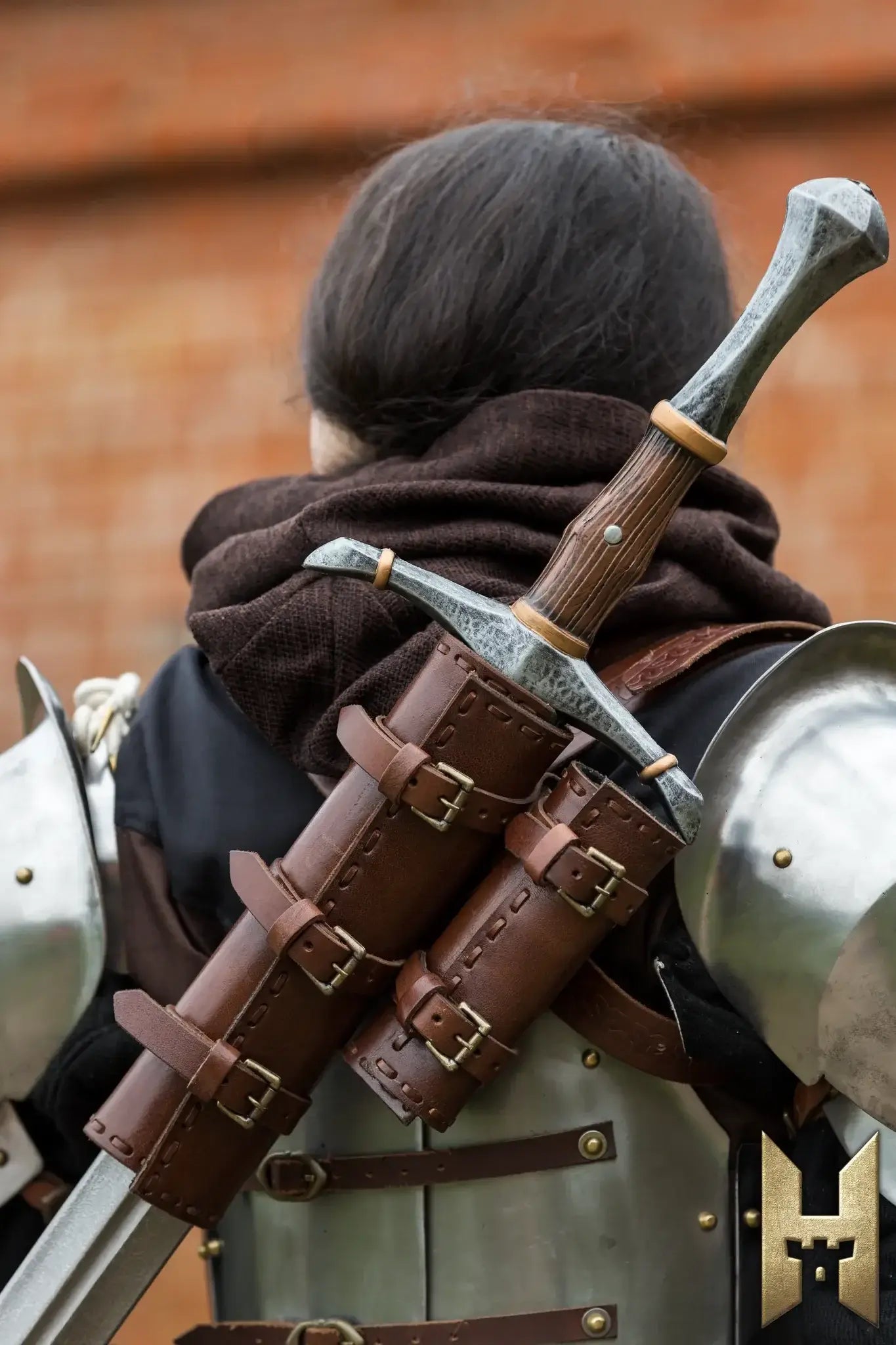 Bastard Sword sheathed on the back of a knight in armor, highlighting its detailed handle and scabbard.