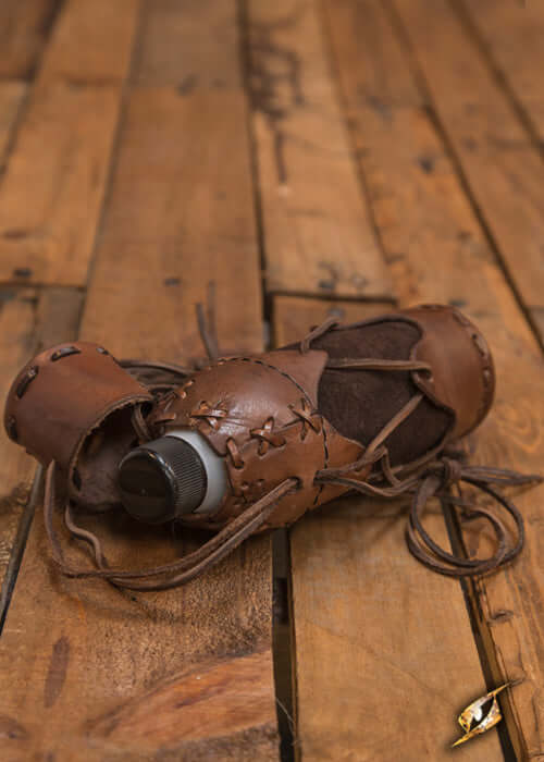 500 ml Plastic Flask for Laced Bottlehold wrapped in leather on a wooden surface.