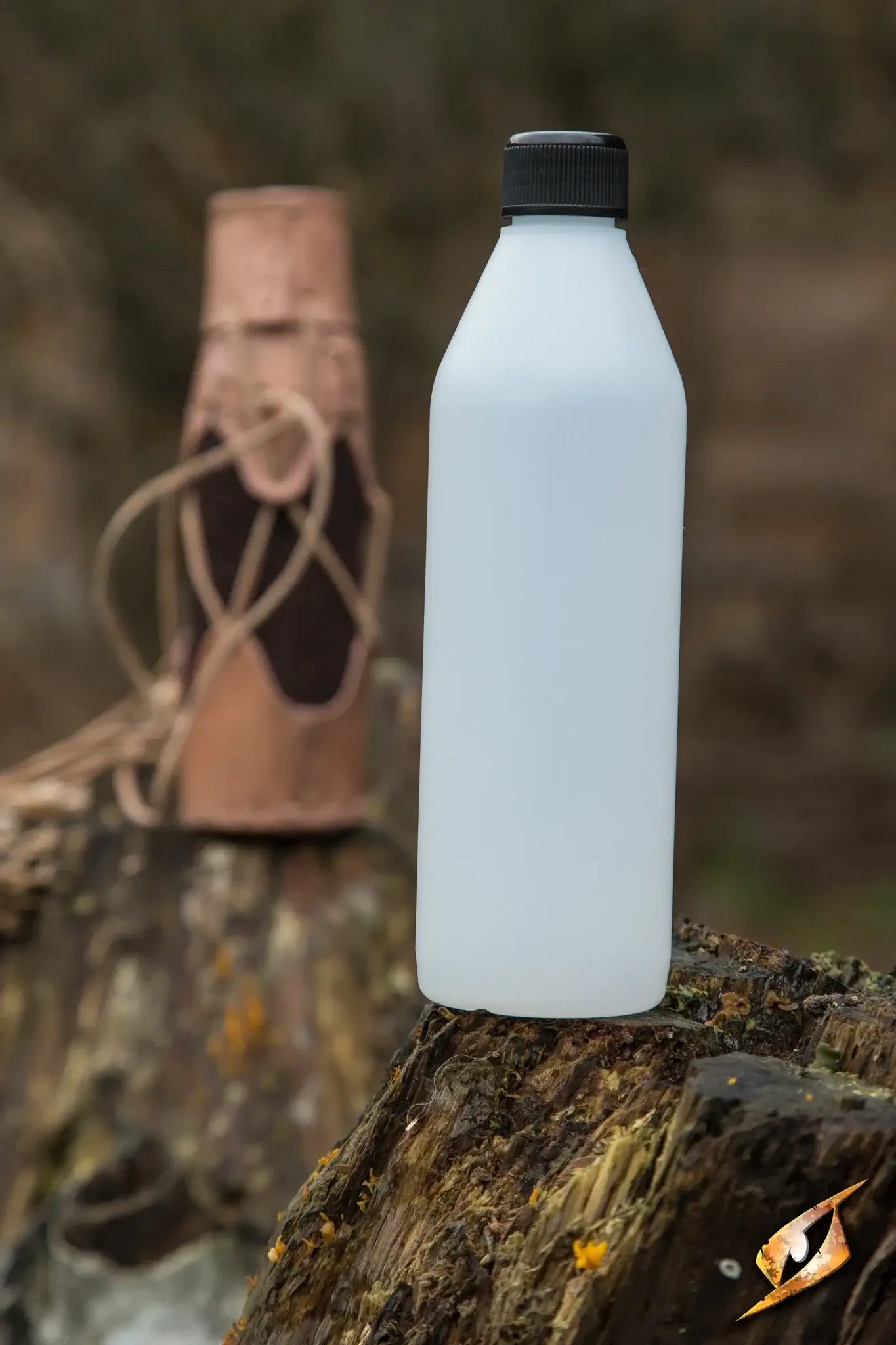 500 ml Plastic Flask for Laced Bottlehold displayed on a tree stump outdoors.