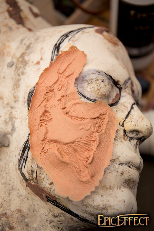 Zombie Cheekbone Exposed on a sculpted head display showing detailed texture and design.