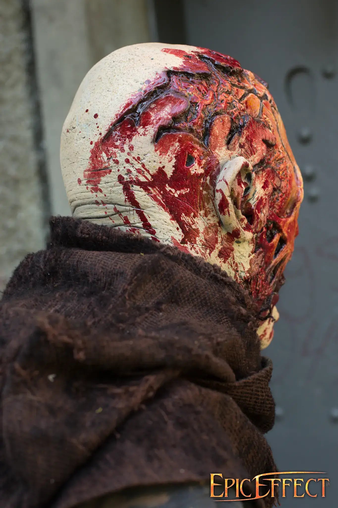 Half Face Zombie figure with gory details, showcasing the unsettling features and zombie-like appearance.