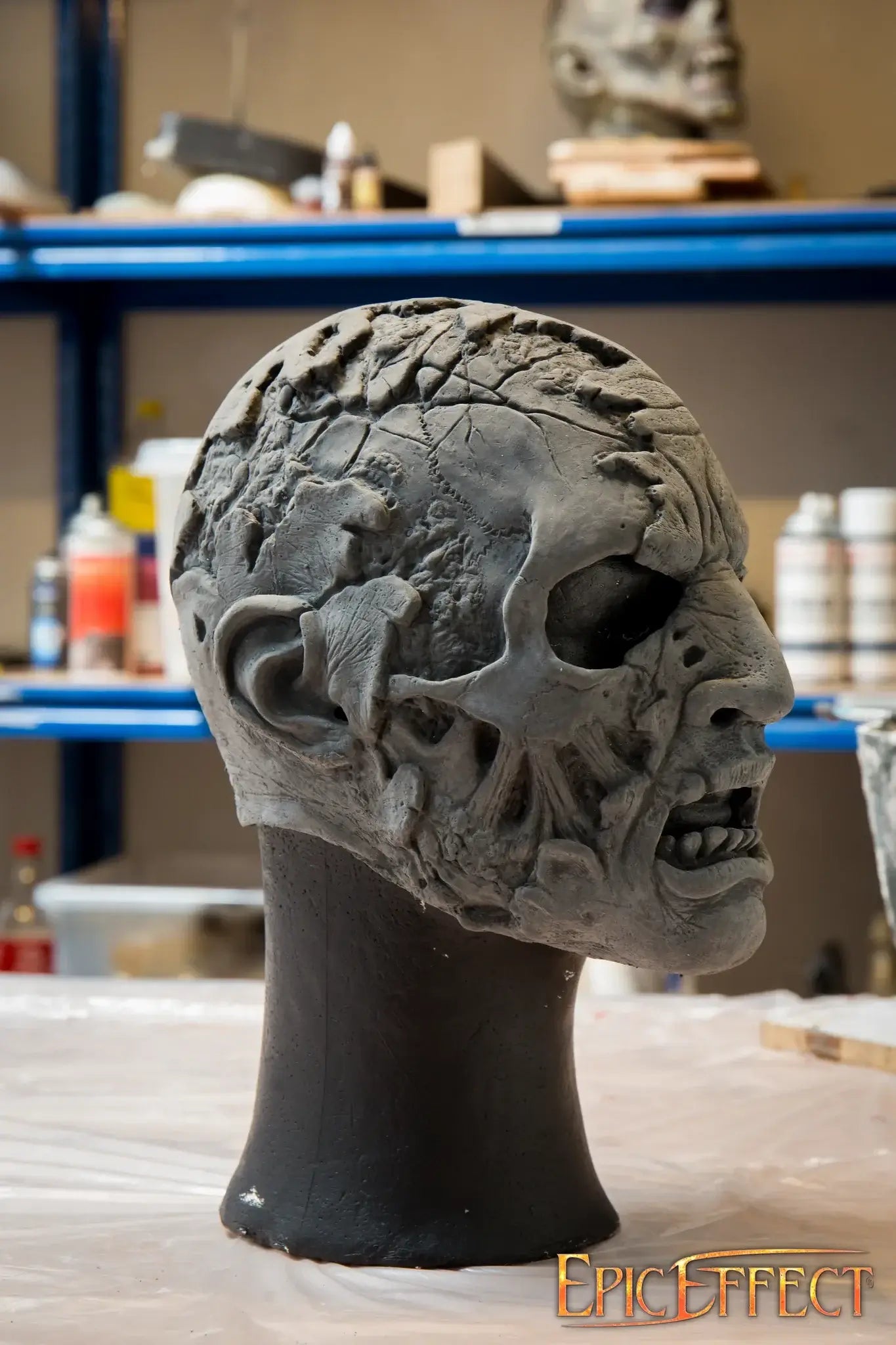 Half Face Zombie sculpture showcasing detailed decayed features and grotesque texture.