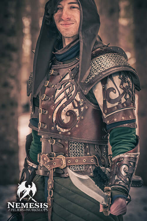 Bowie knife held by a ranger in detailed leather armor, standing in an ancient forest.