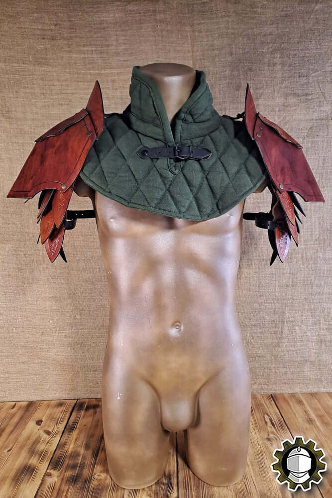Pauldrons Namor (Fighter) displayed on a mannequin, showcasing detailed armor design and craftsmanship.