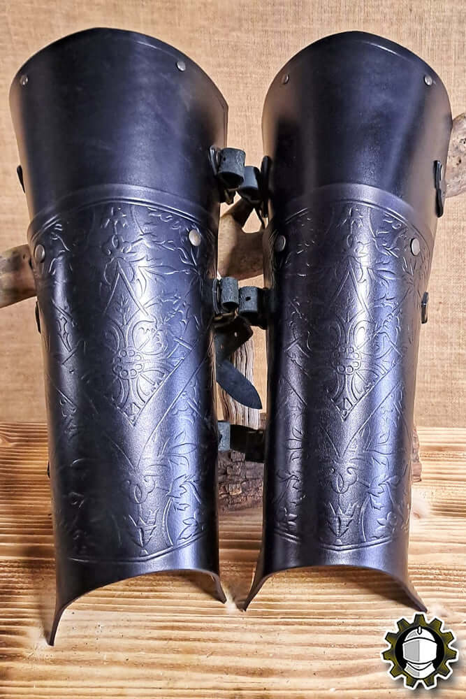 Leg Protection Brian (Fighter) - Black leather shin guards with engraved design.