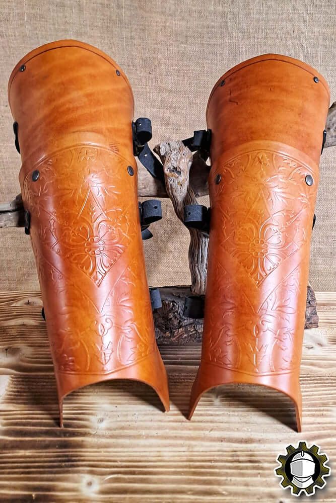 Leg Protection Brian (Fighter) showcased in an elegant leather design with intricate engravings.