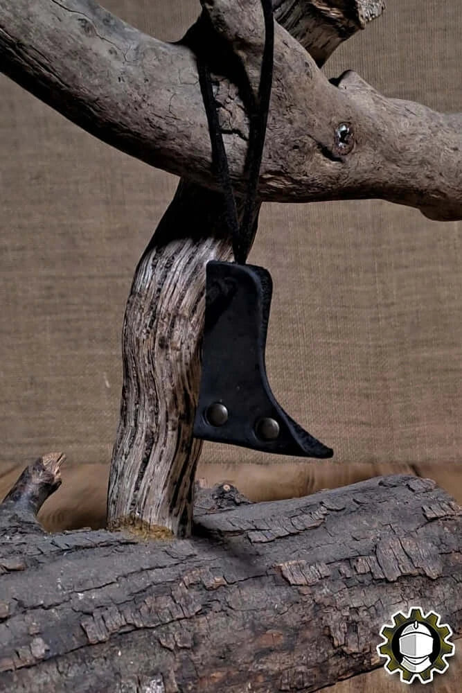 Blade Hook (New Blood) hanging on wood, showcasing its sleek, functional design for securing crossguard-less weapons.