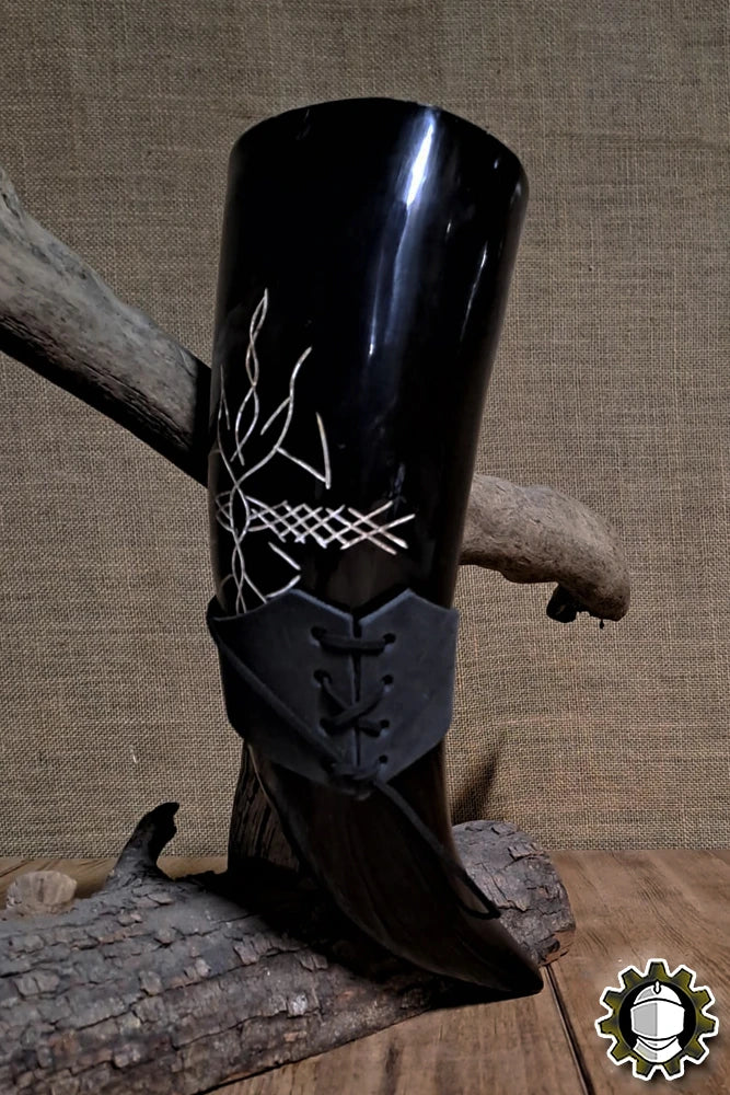 Horn Holder (New Blood) featuring a black drinking horn with intricate designs attached to a rustic wood display.