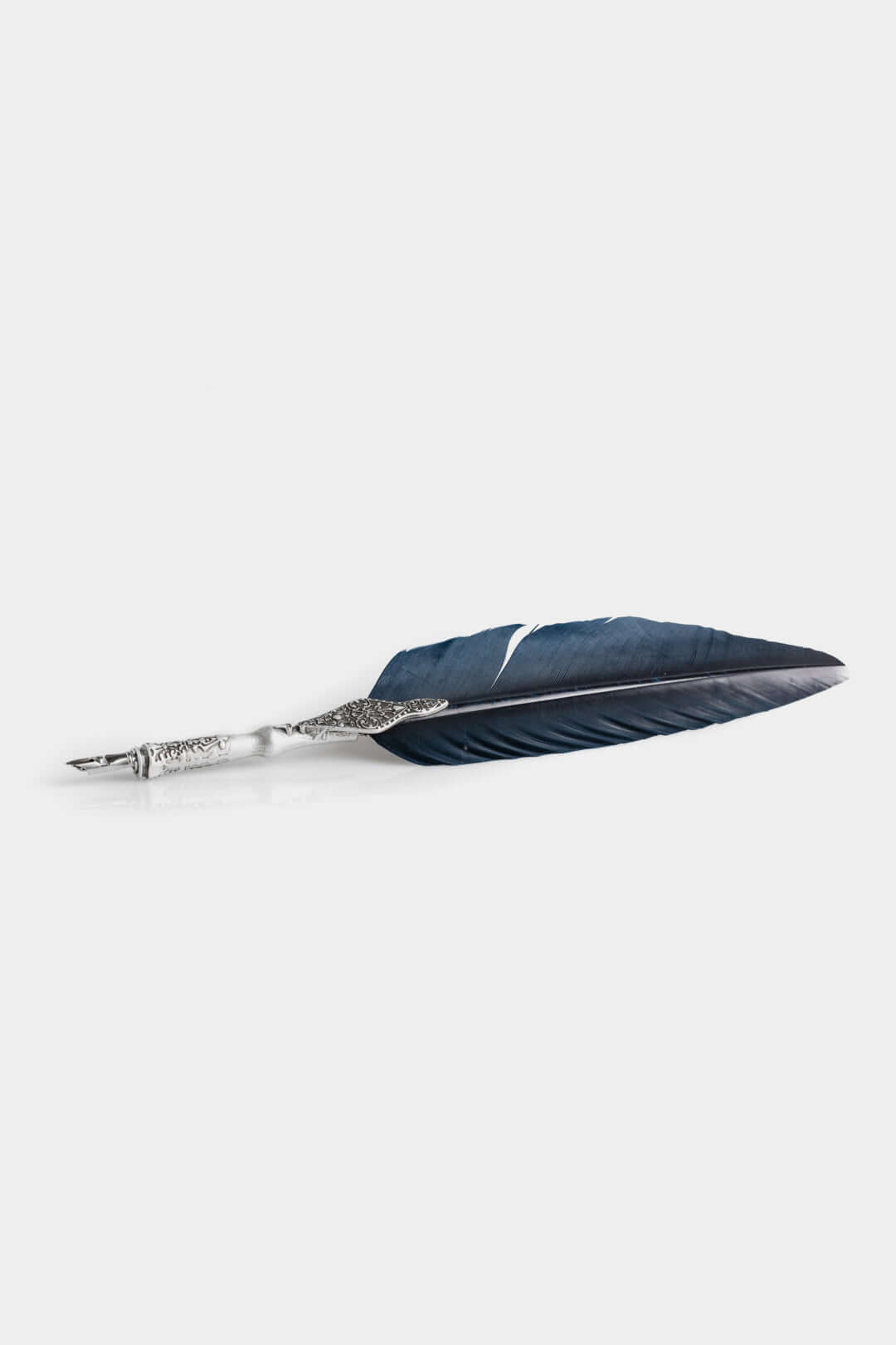 Calligraphic Writing Set featuring a metal-adorned feather pen with intricate detailing.