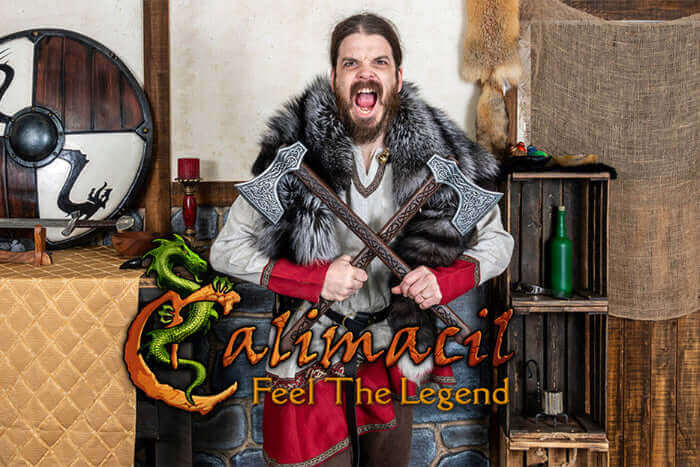 A man in warrior attire, holding axes and shouting passionately, with a medieval background and Calimacil logo.