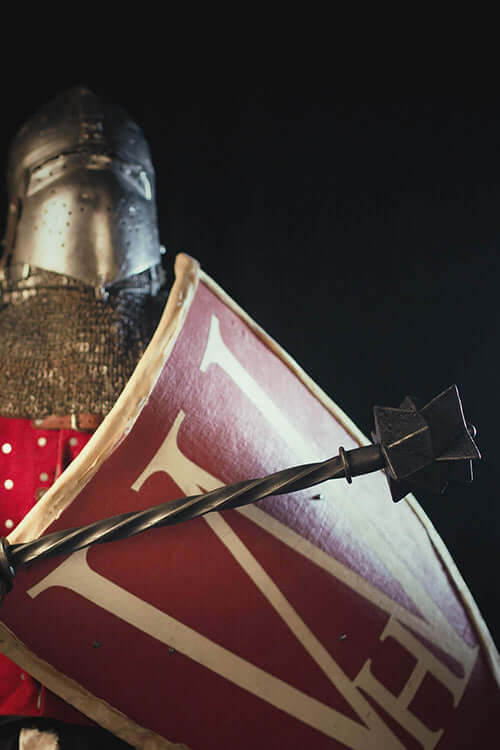 Bailiff's Mace held by a knight in armor with a shield, inspired by Kingdom Come: Deliverance.